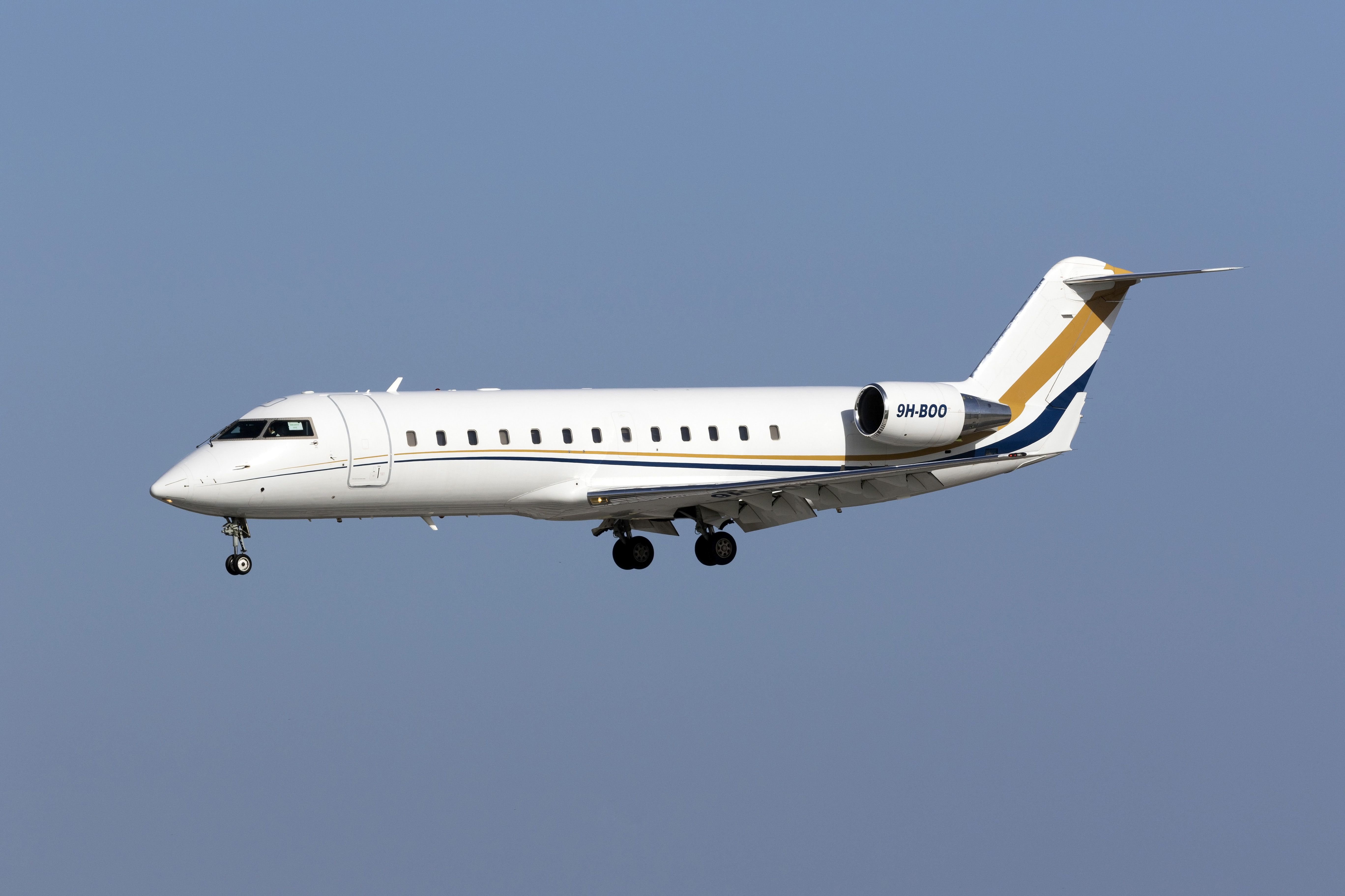A Bombardier Challenger 850 flying in the sky.
