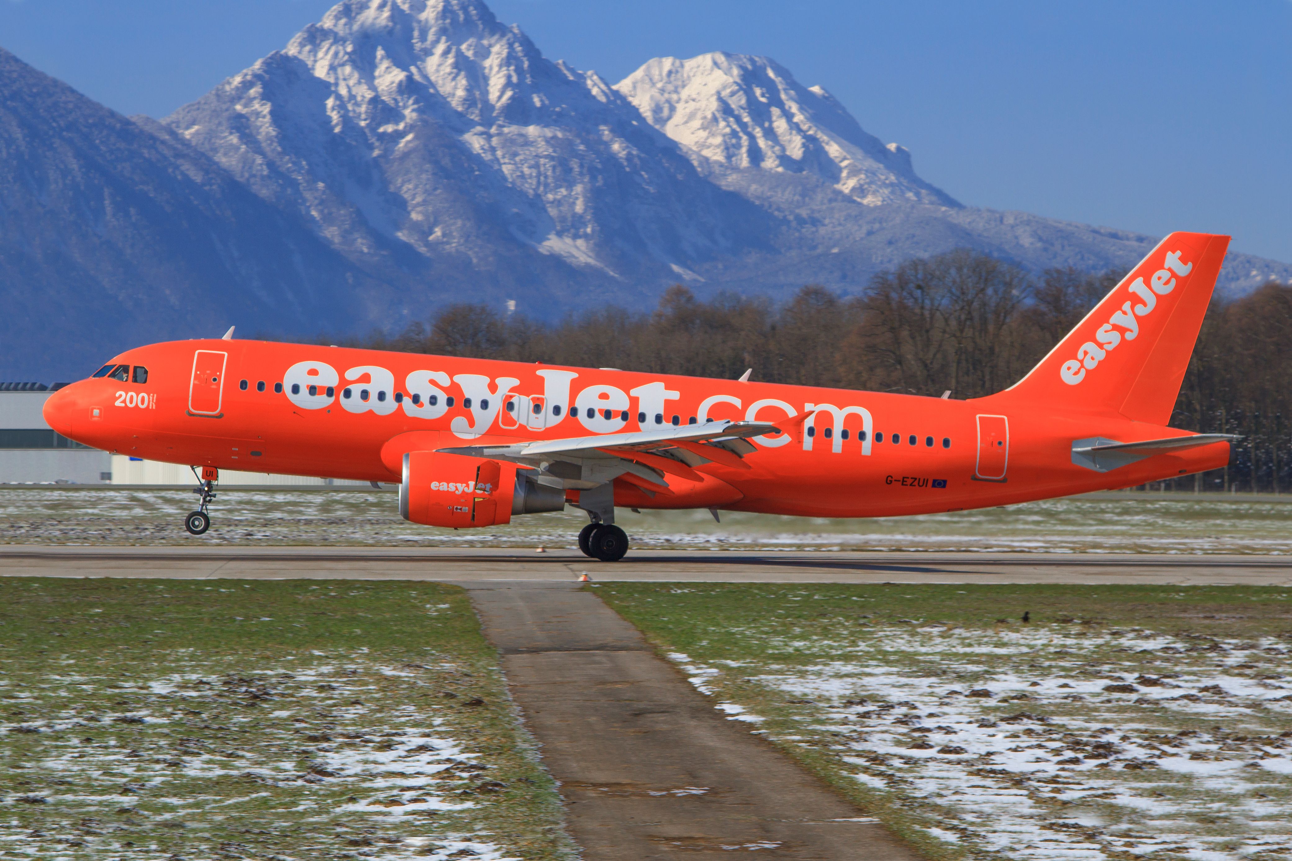 An easyJet Airbus A320 in All-Orange Livery just about to takeoff.