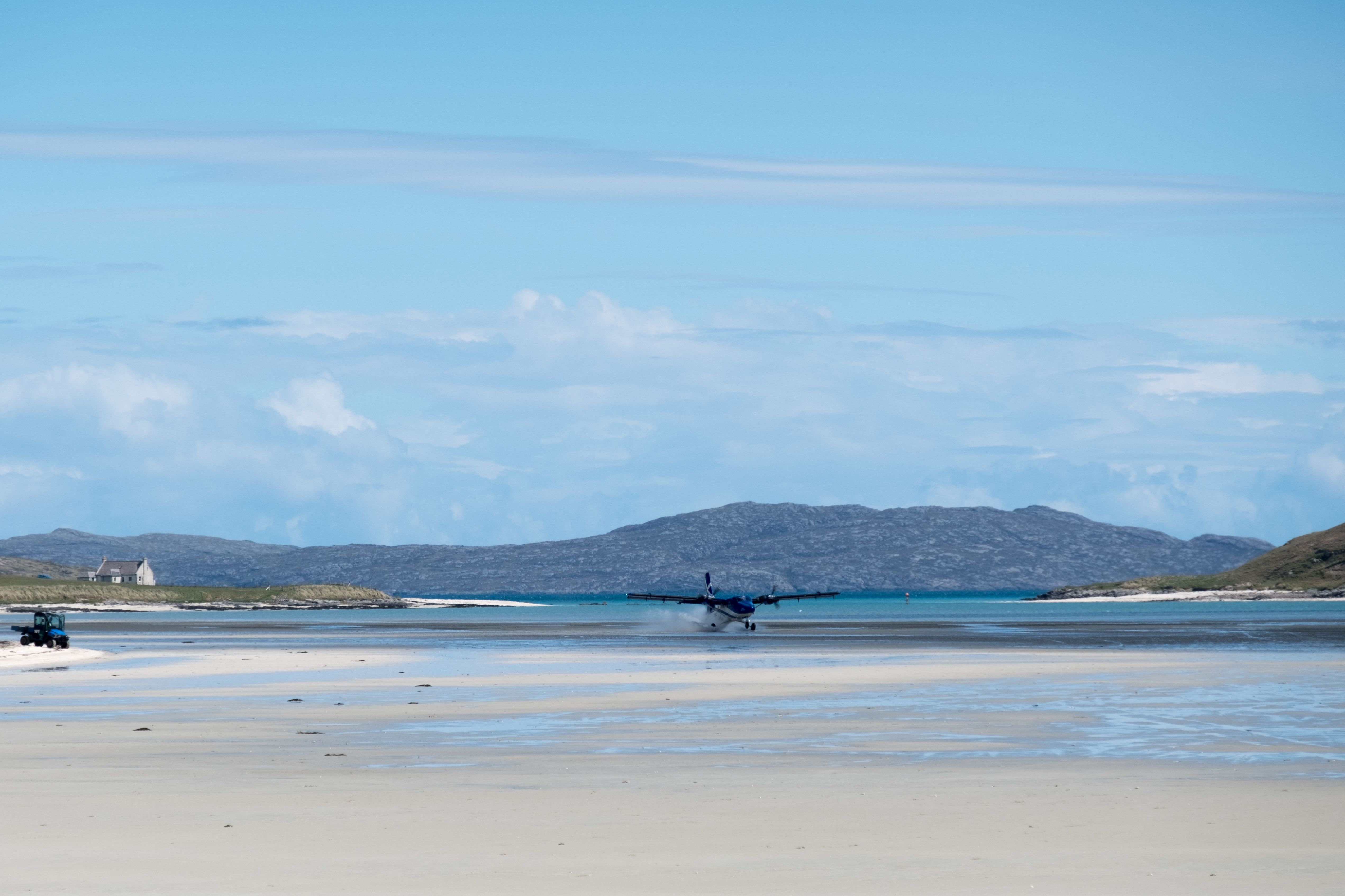 A Twin Otter landing at Barra Airport in Scottland.