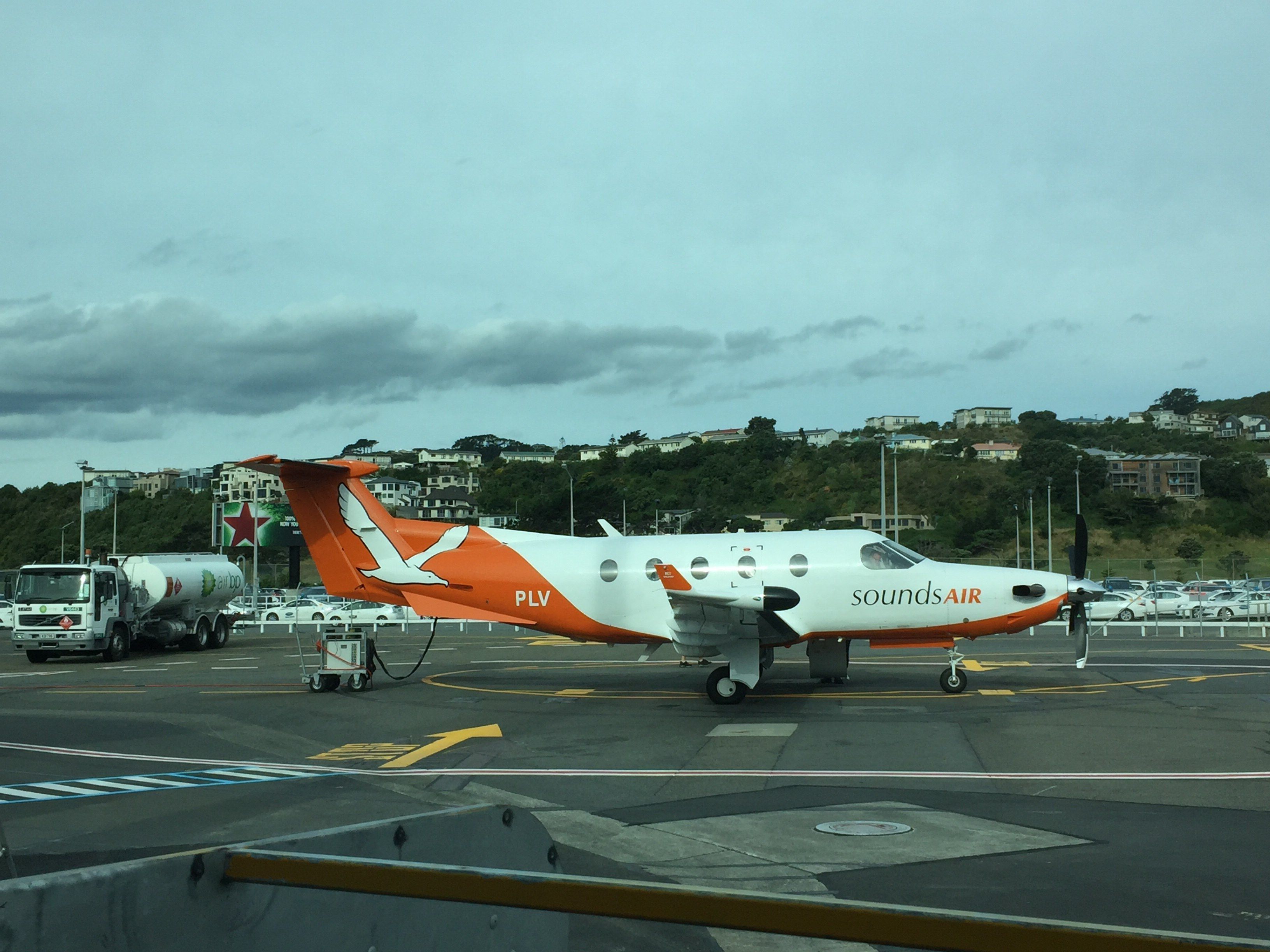 A Sounds Air Pilatus PC-12 parked at an airport.