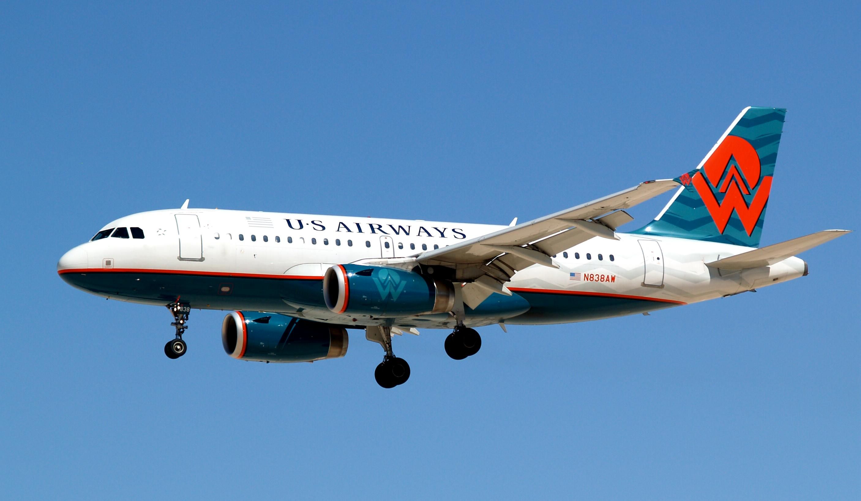 A US Airways A319 flying in the sky.