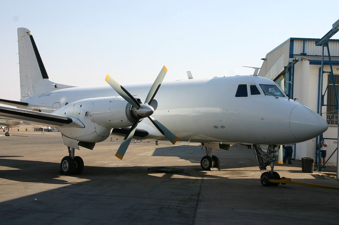 A Grumman Gulfstream 1 parked at an airfield.