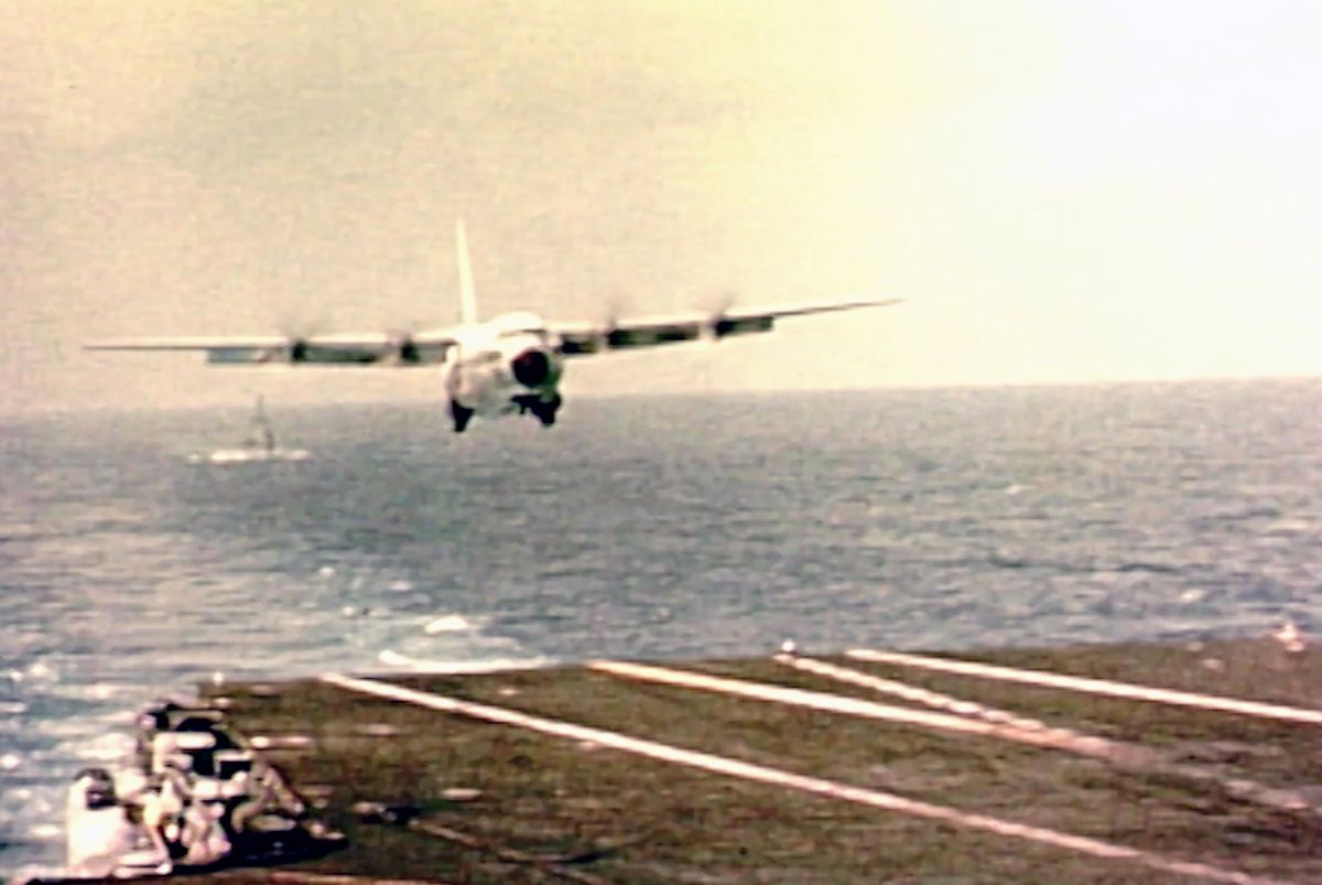 A C-130 about to land on an Aircraft Carrier.