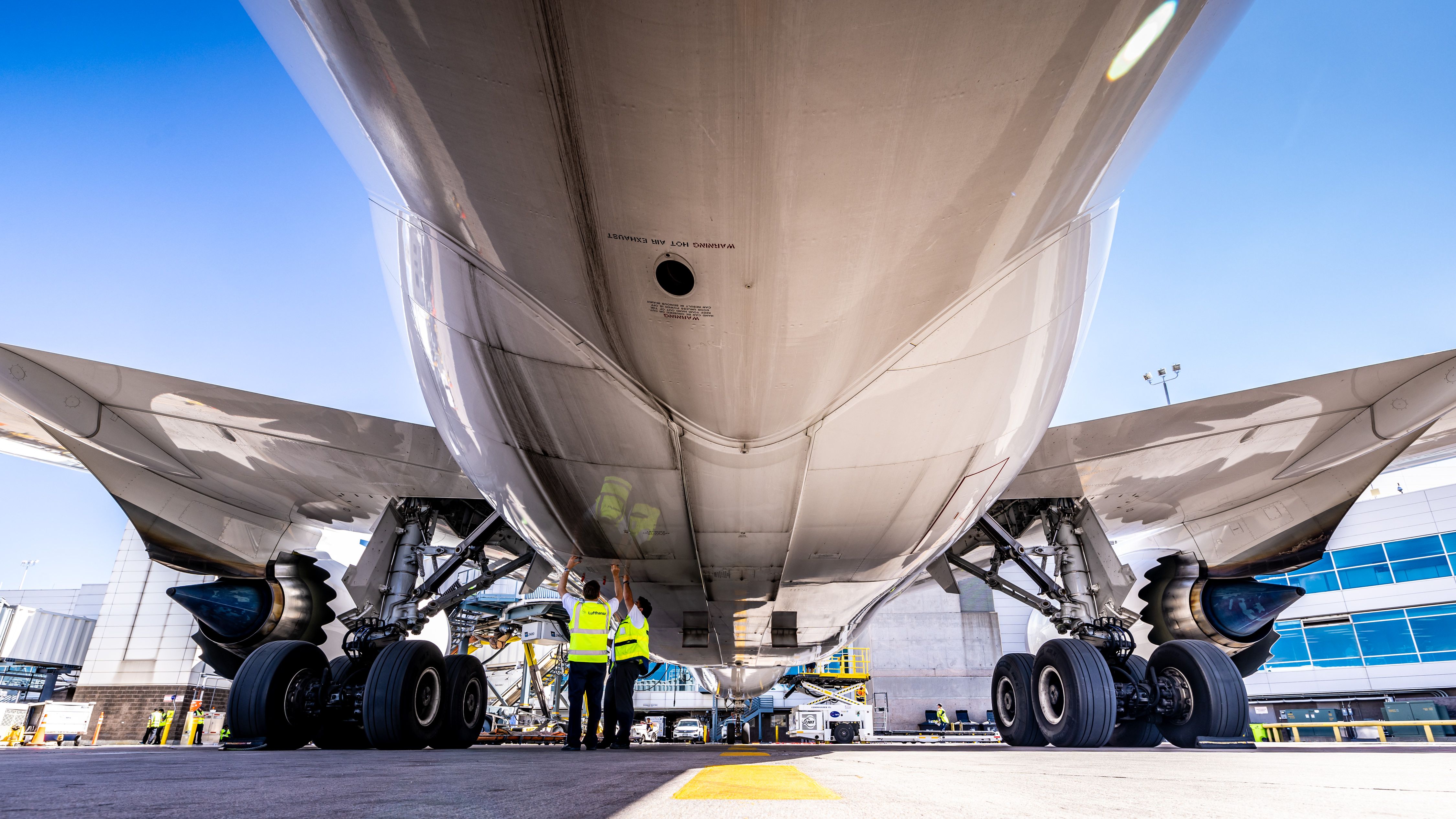 A closeup of a Lufthansa aircraft's landing gear.