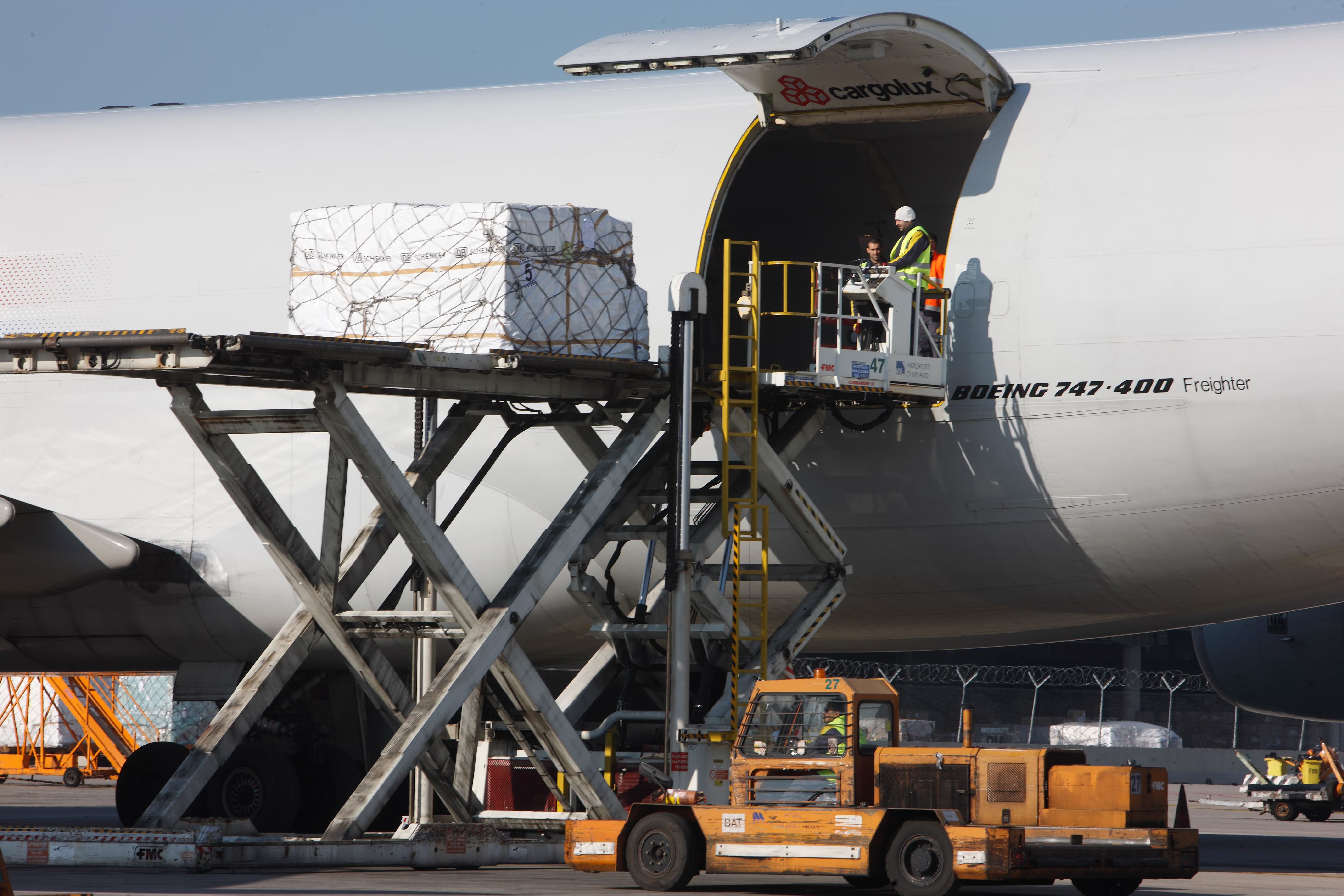 Workers load cargo onto a Boeing 747F.