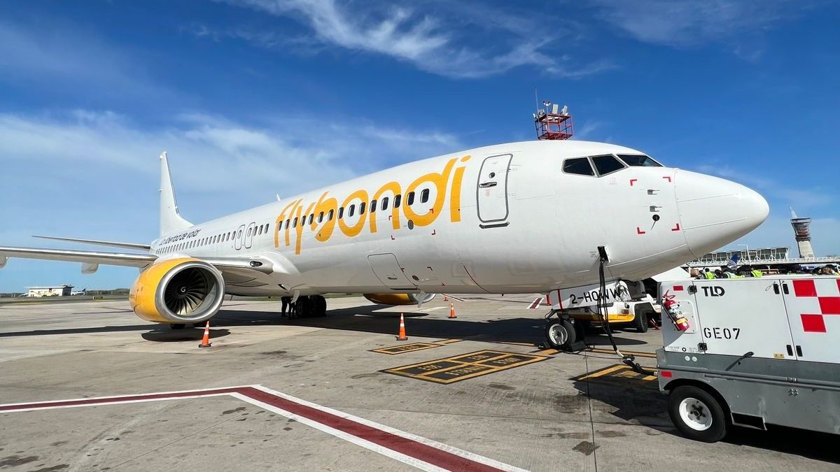 A Flybondi Boeing 737-800 parked at an airport gate.