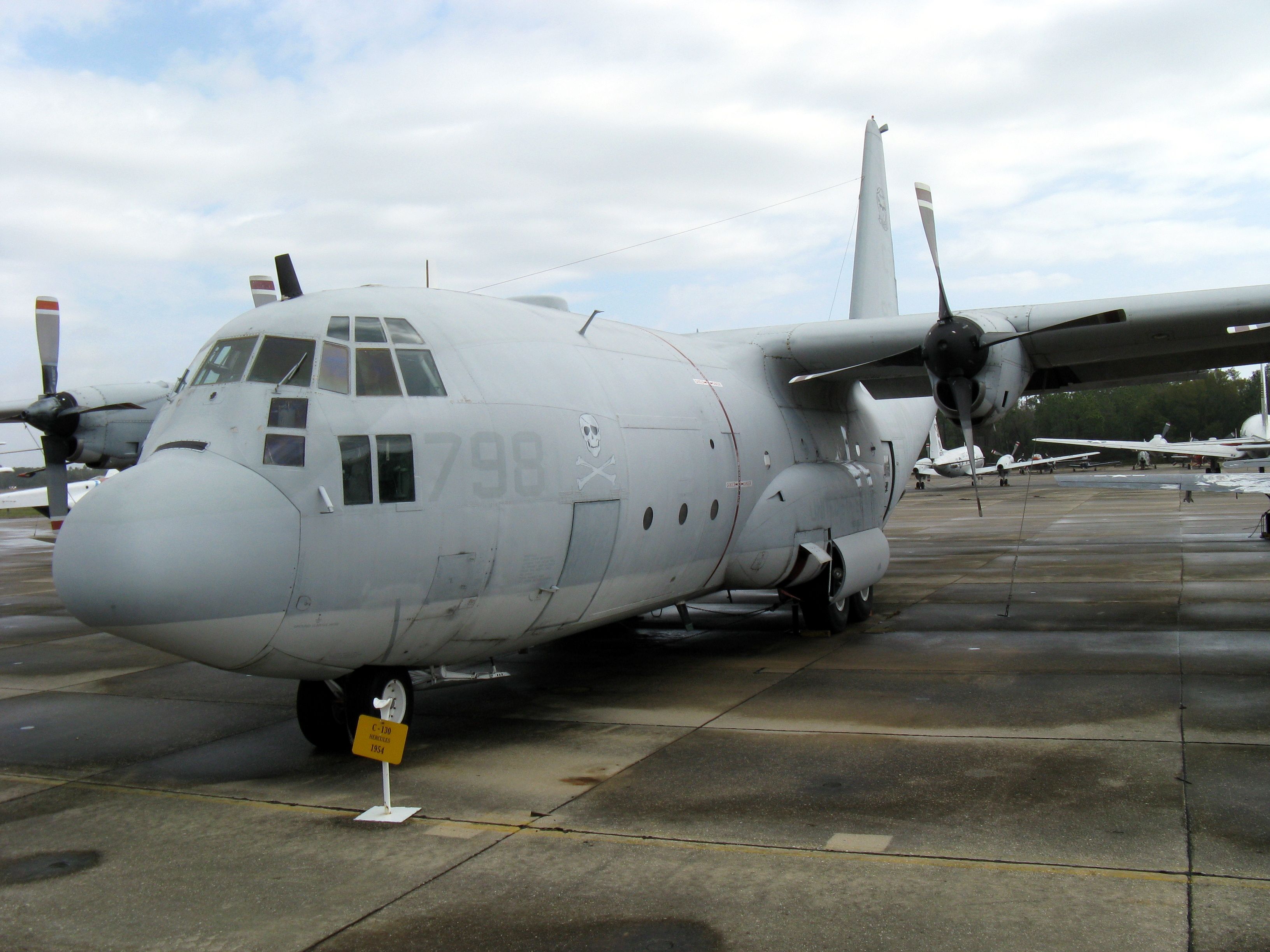 The C-130 used to conduct aircraft carrier tests parked on an airfield.