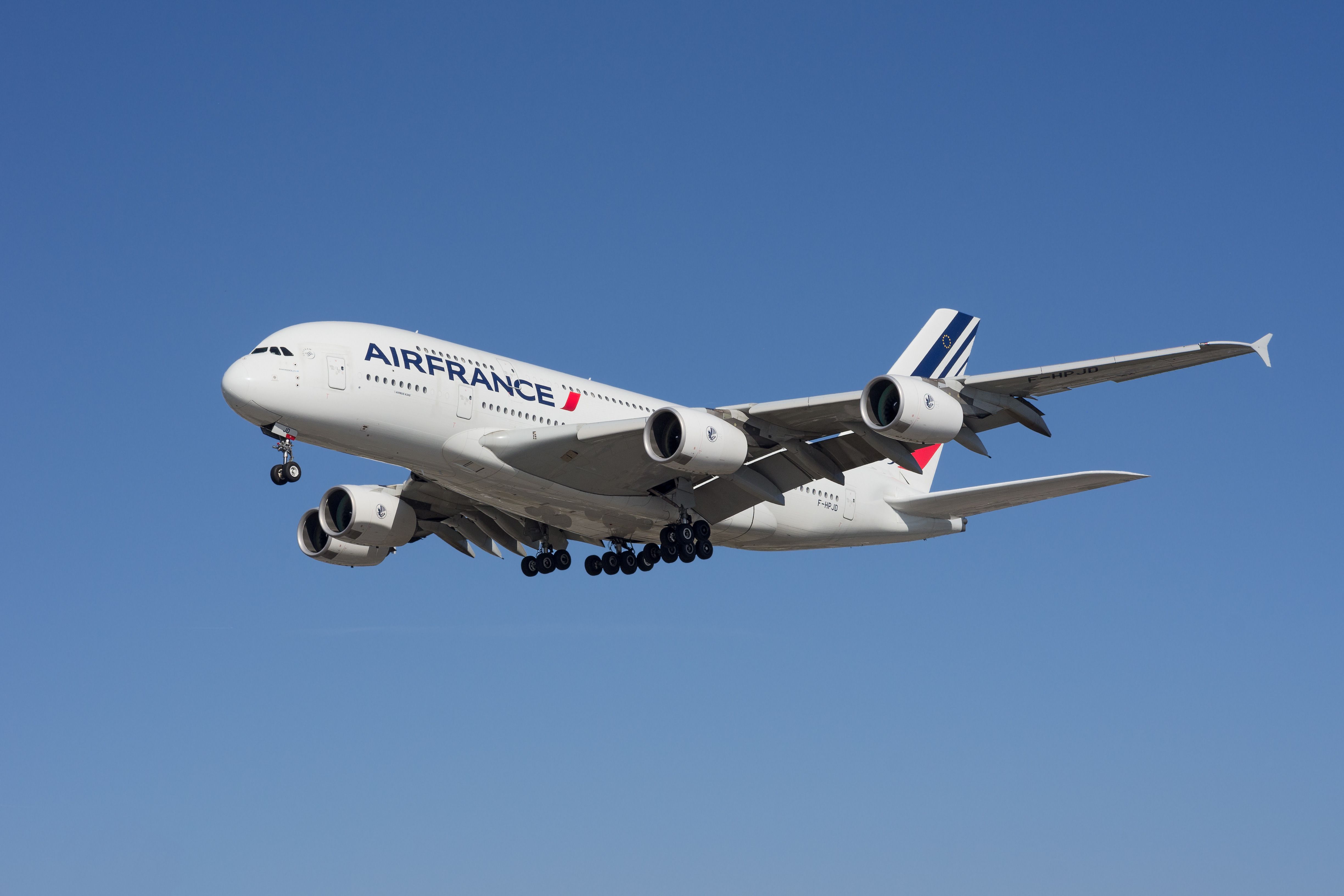 An Air France Airbus A380 flying in the sky.