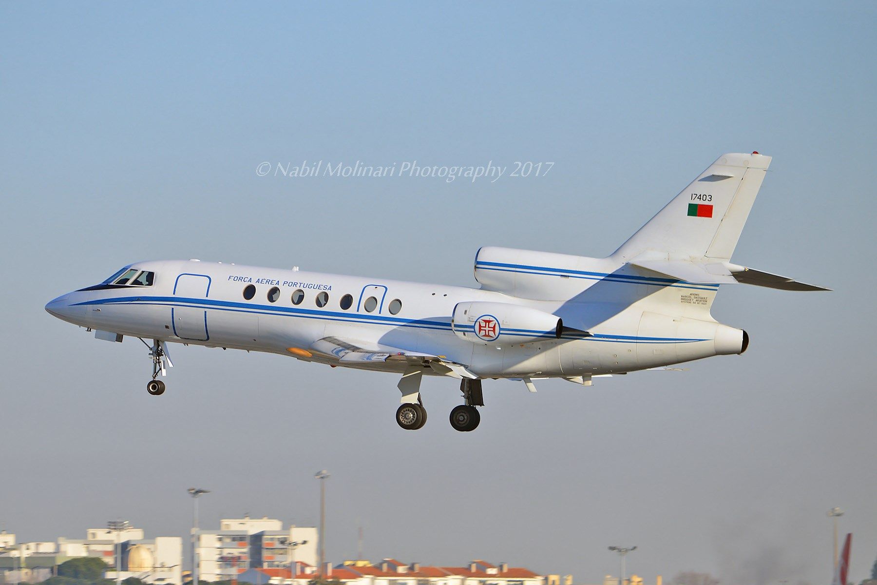 A Dassault Falcon 50 flying in the sky.