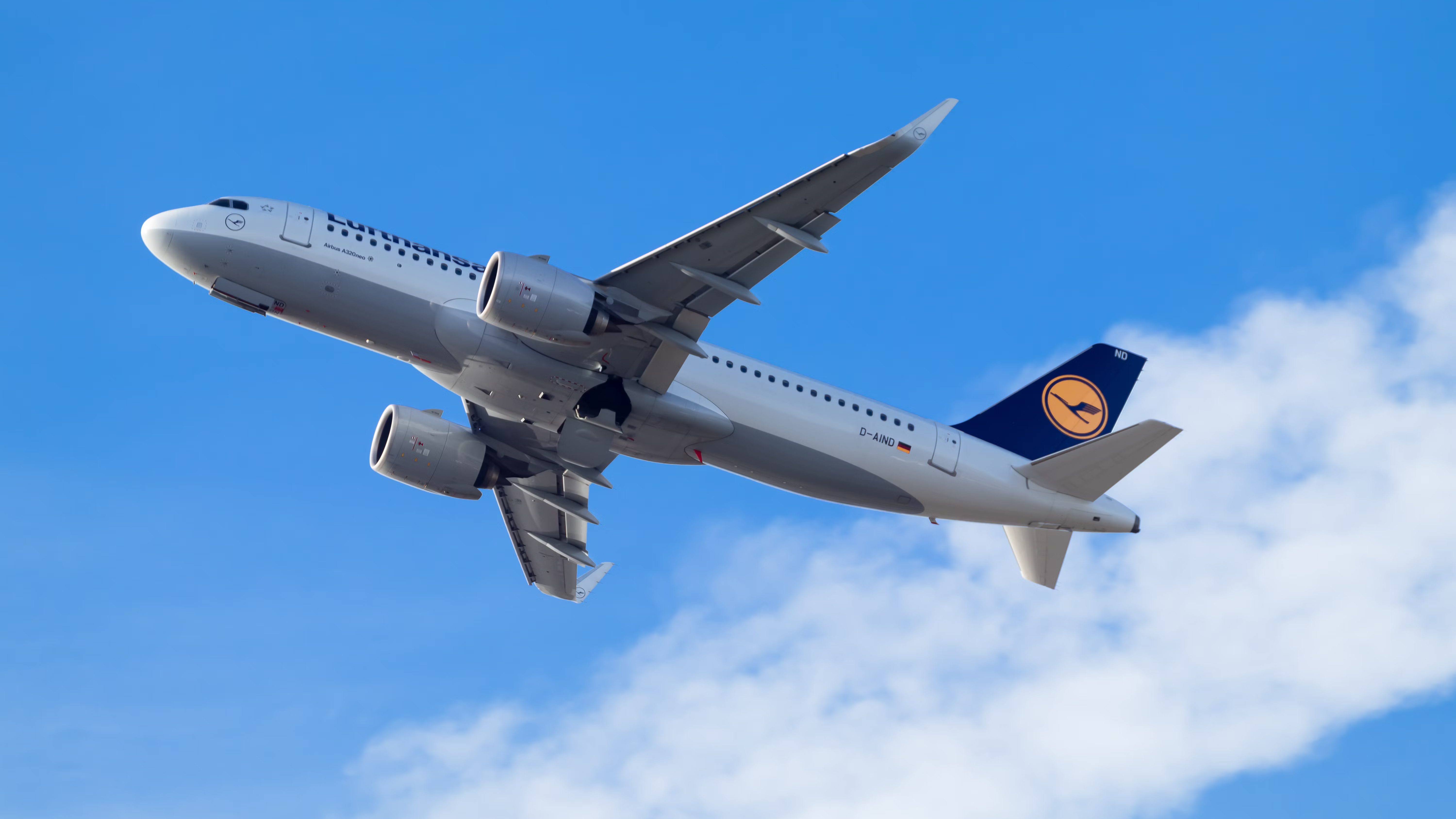 A Lufthansa Aircraft flying in the sky.