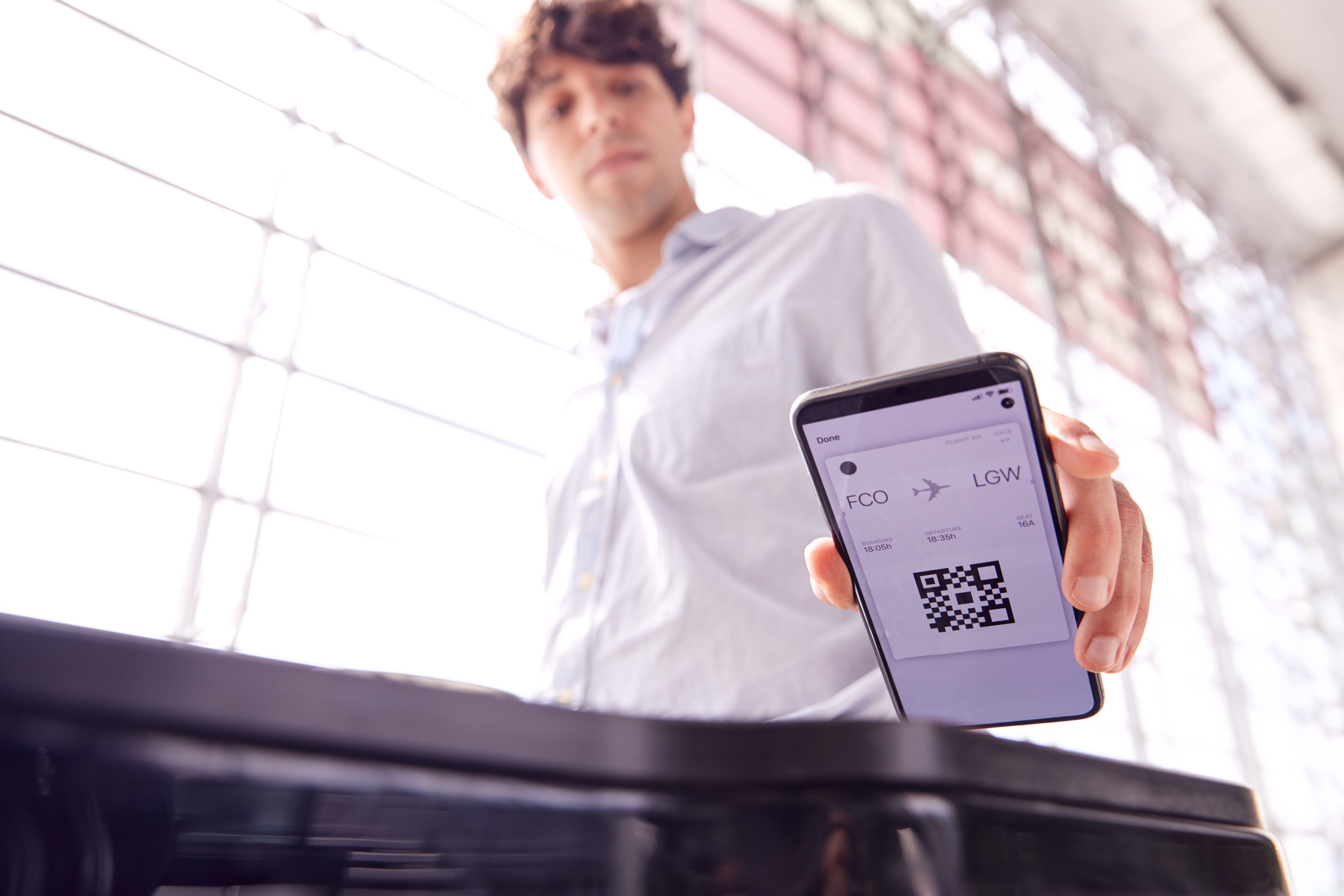 A passenger scanning a boarding pass.