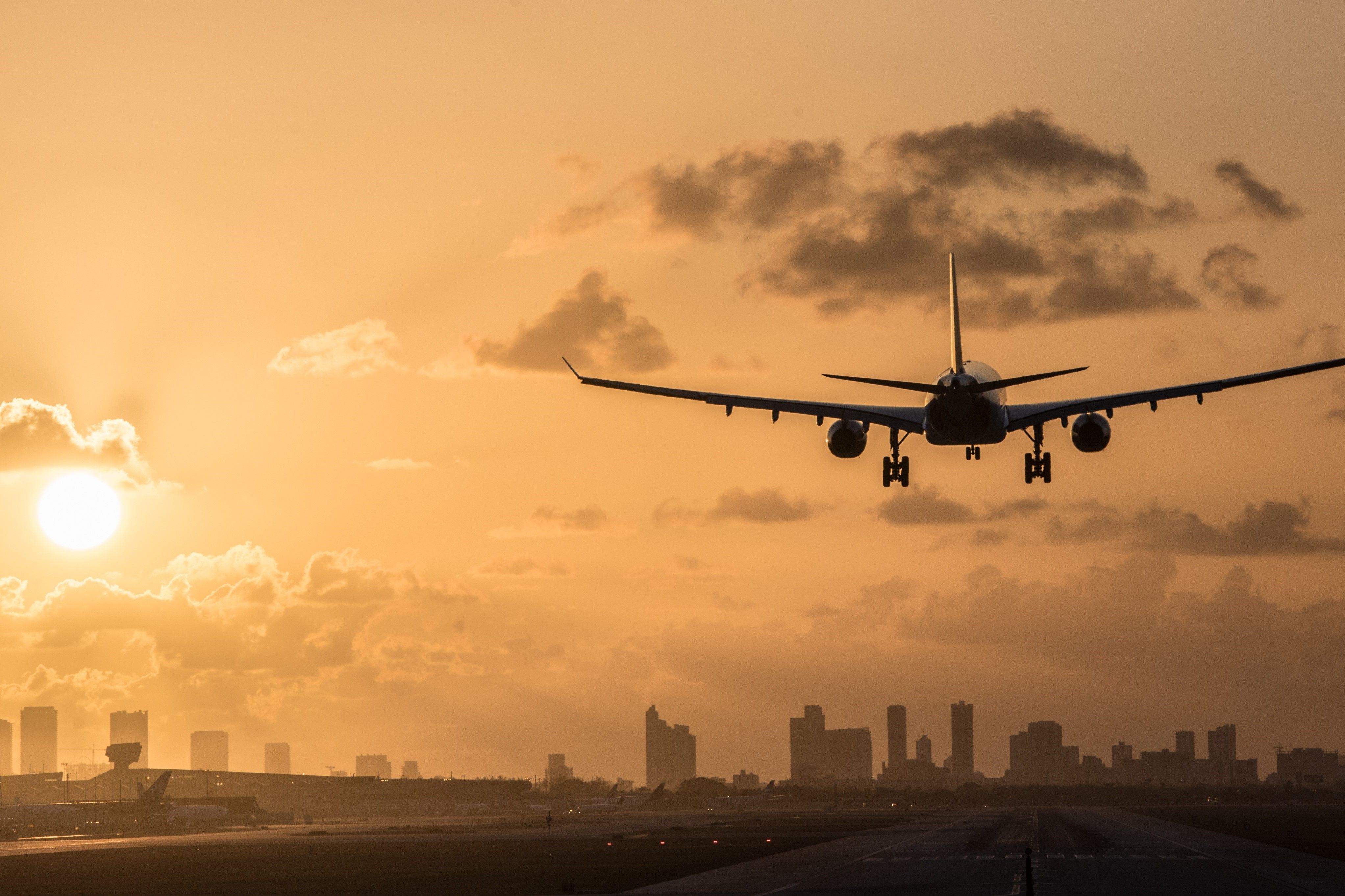 Aircraft Landing at MIA with Miami Skyline with Sunset Thumbnail