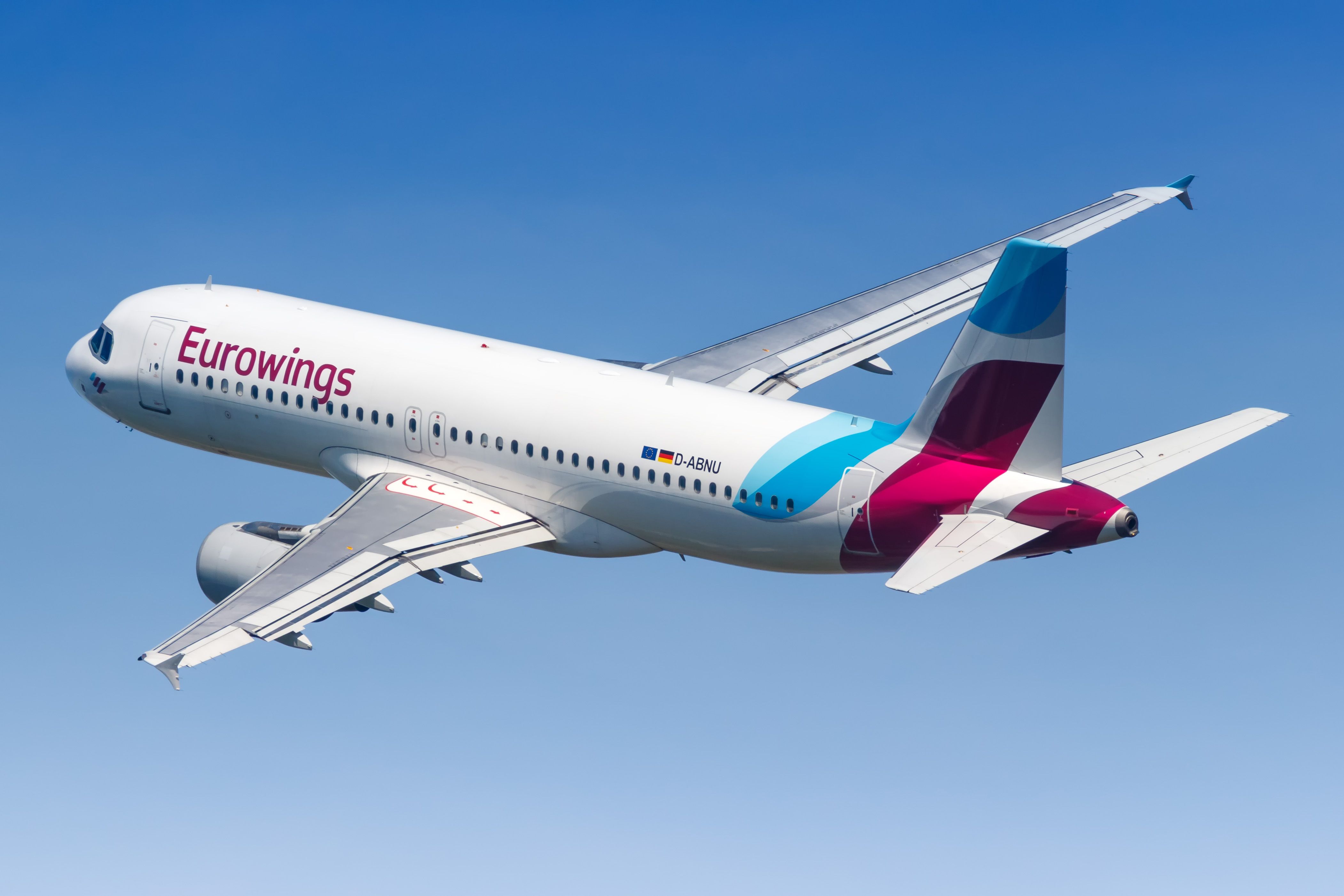 A Eurowings Airbus A320 flying in the sky.
