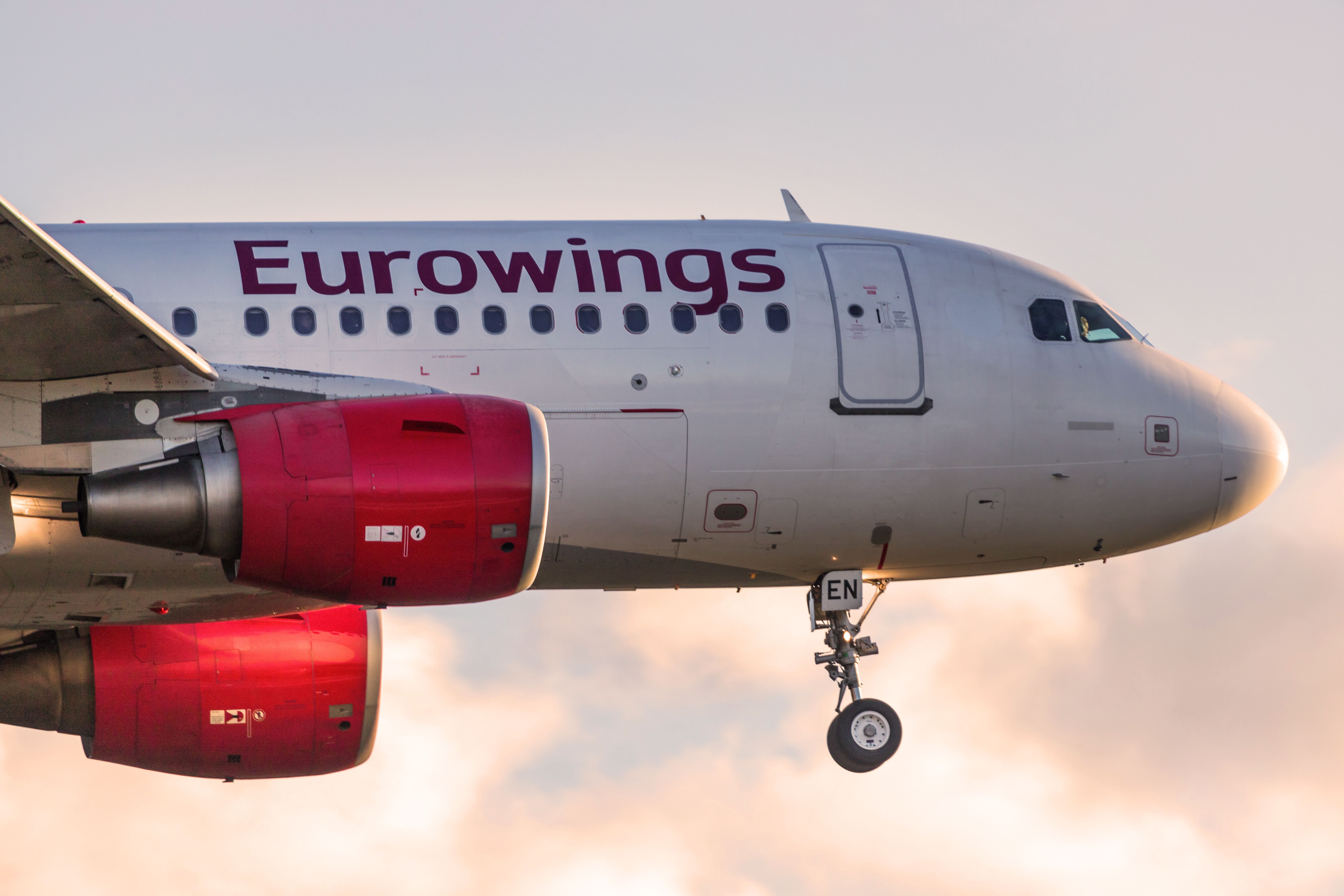A Eurowings aircraft flying in the sky.