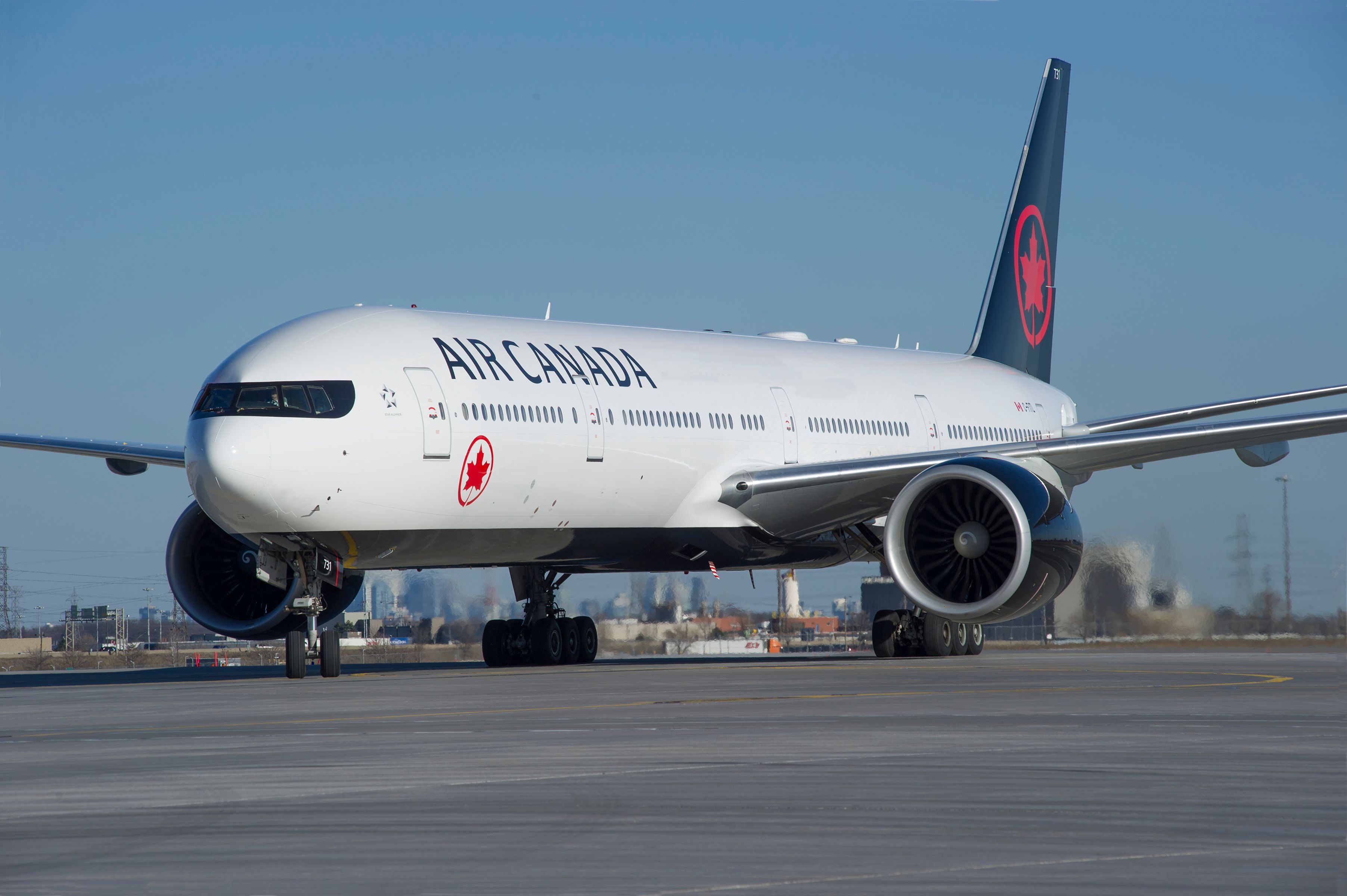 An Air Canada 777-300ER on a taxiway.