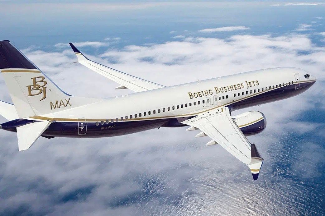 A Boeing Business Jet BBJ 737 MAX 8 flying in the sky.