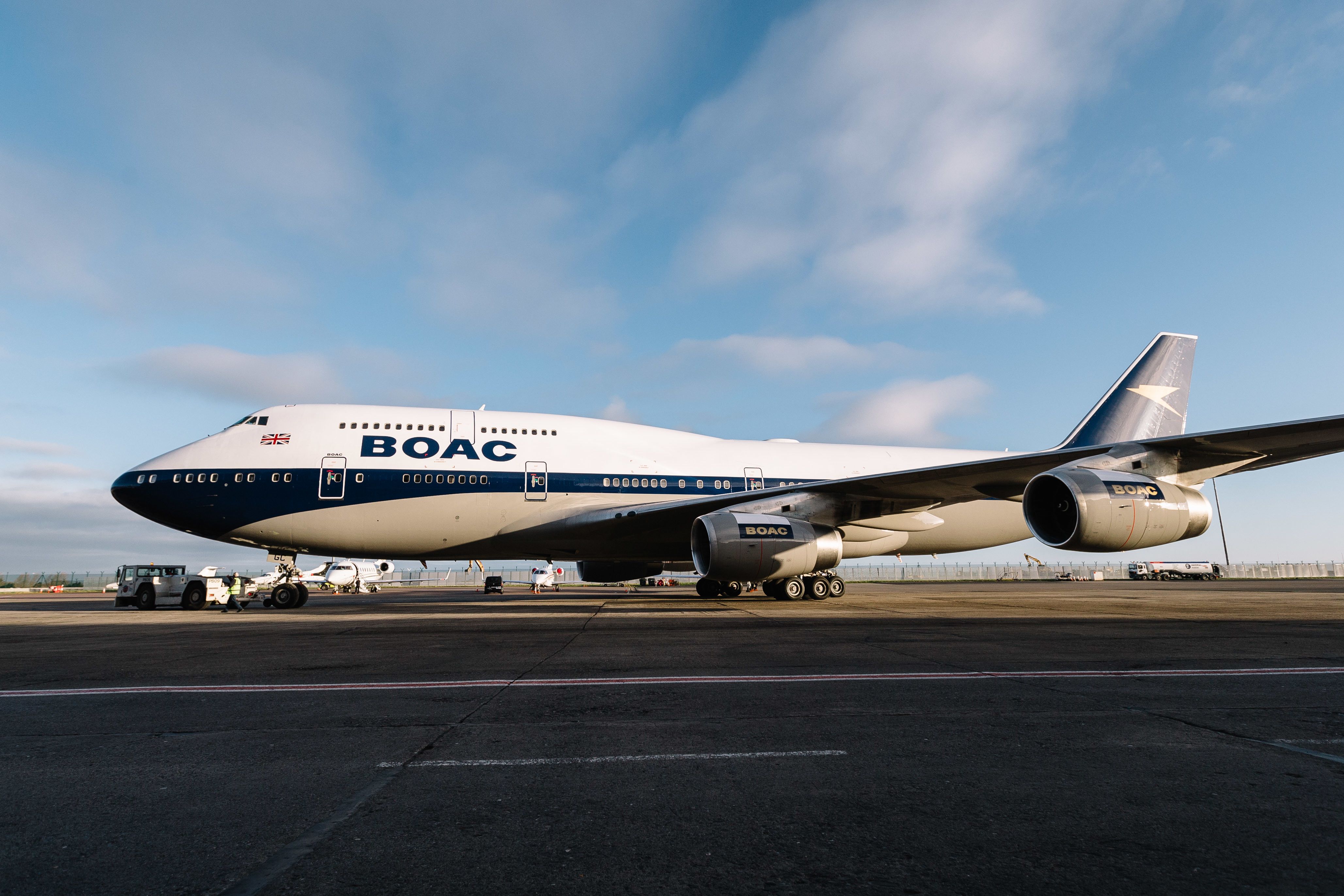 A British Airways Boeing 747 in retro BOAC livery being pushed back.