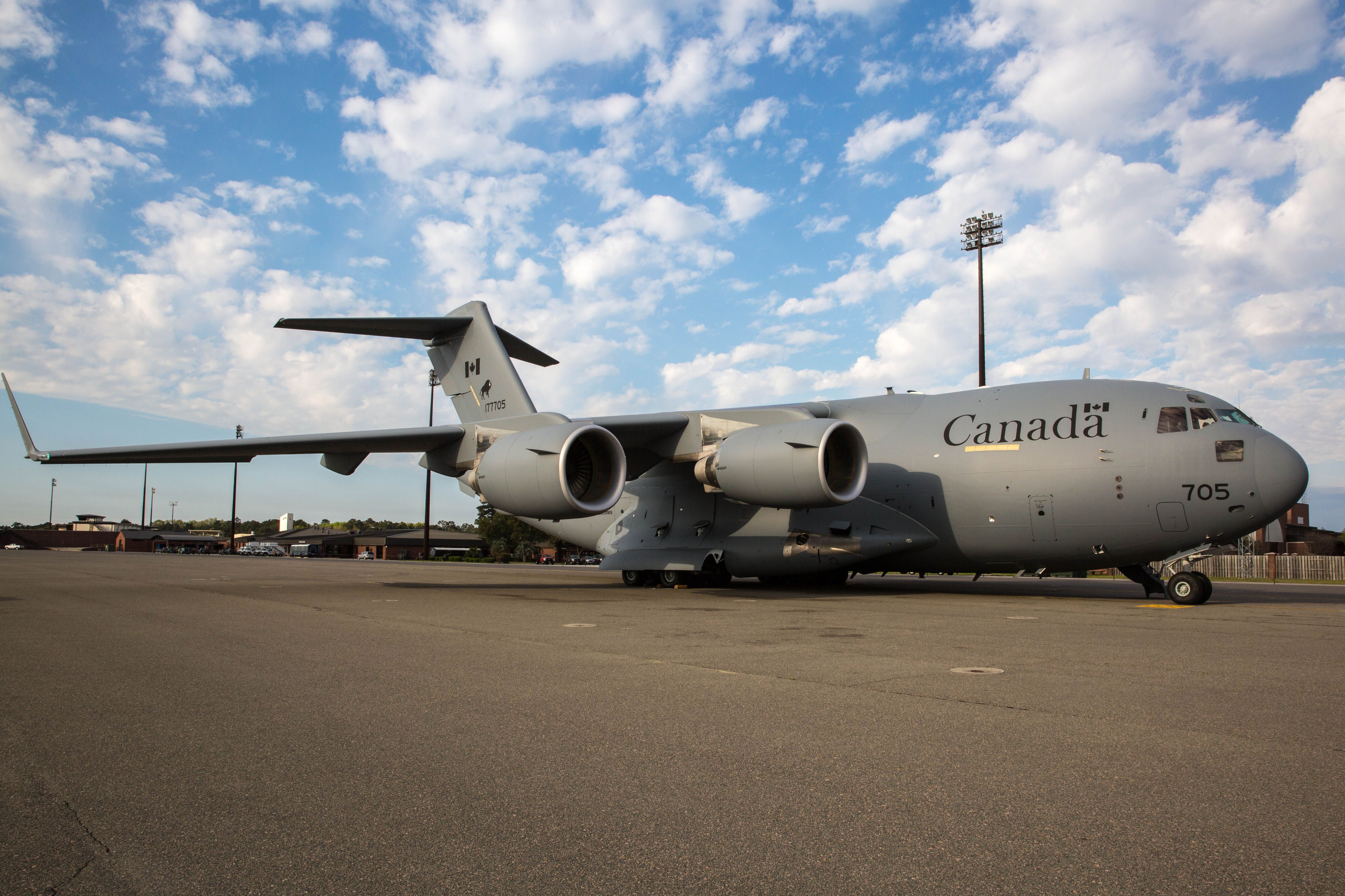 A Royal Canadian Air Force C-17 on the ground at an airport.