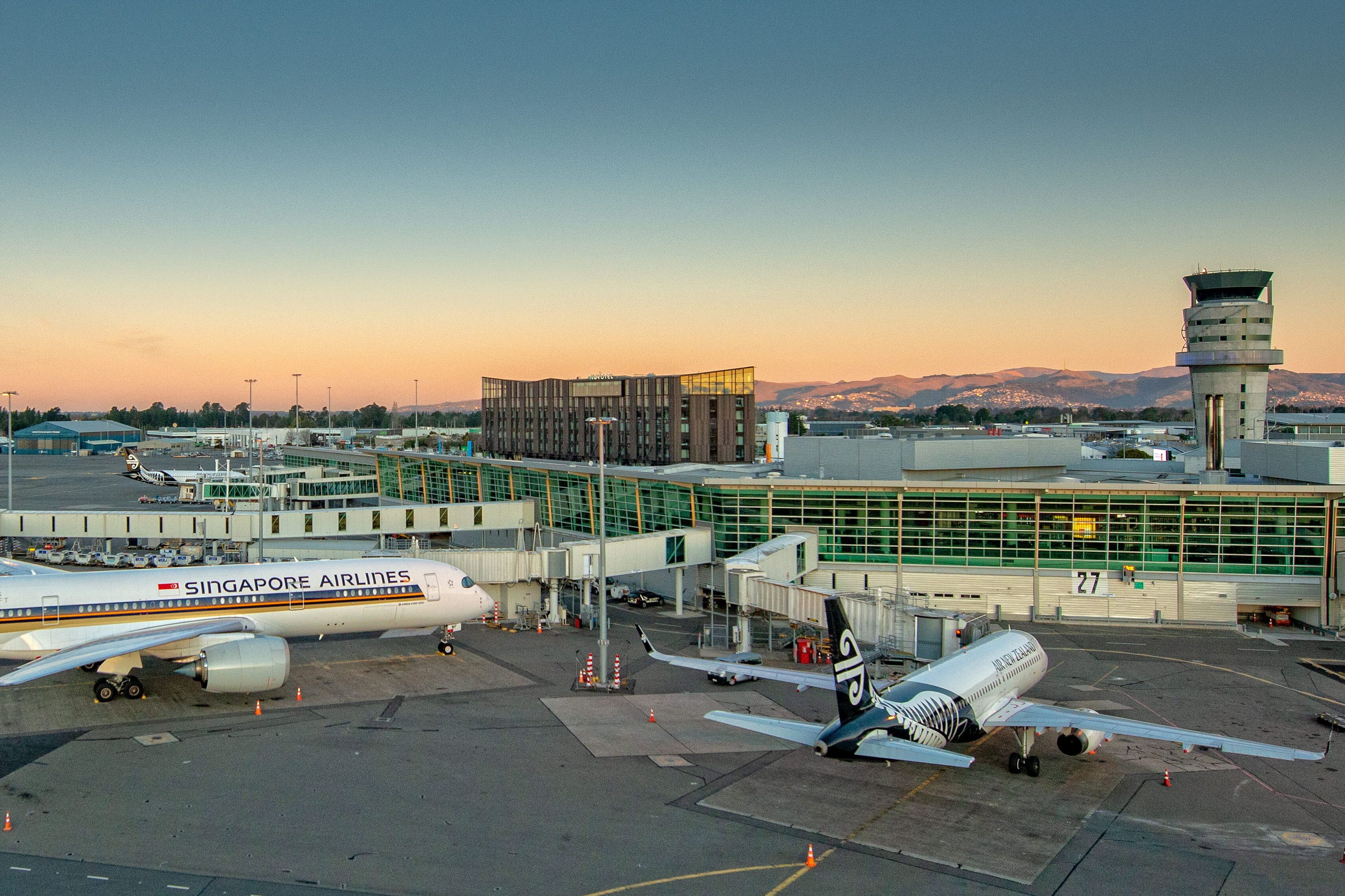 A panoramic view of Christchurch Airport at dusk.