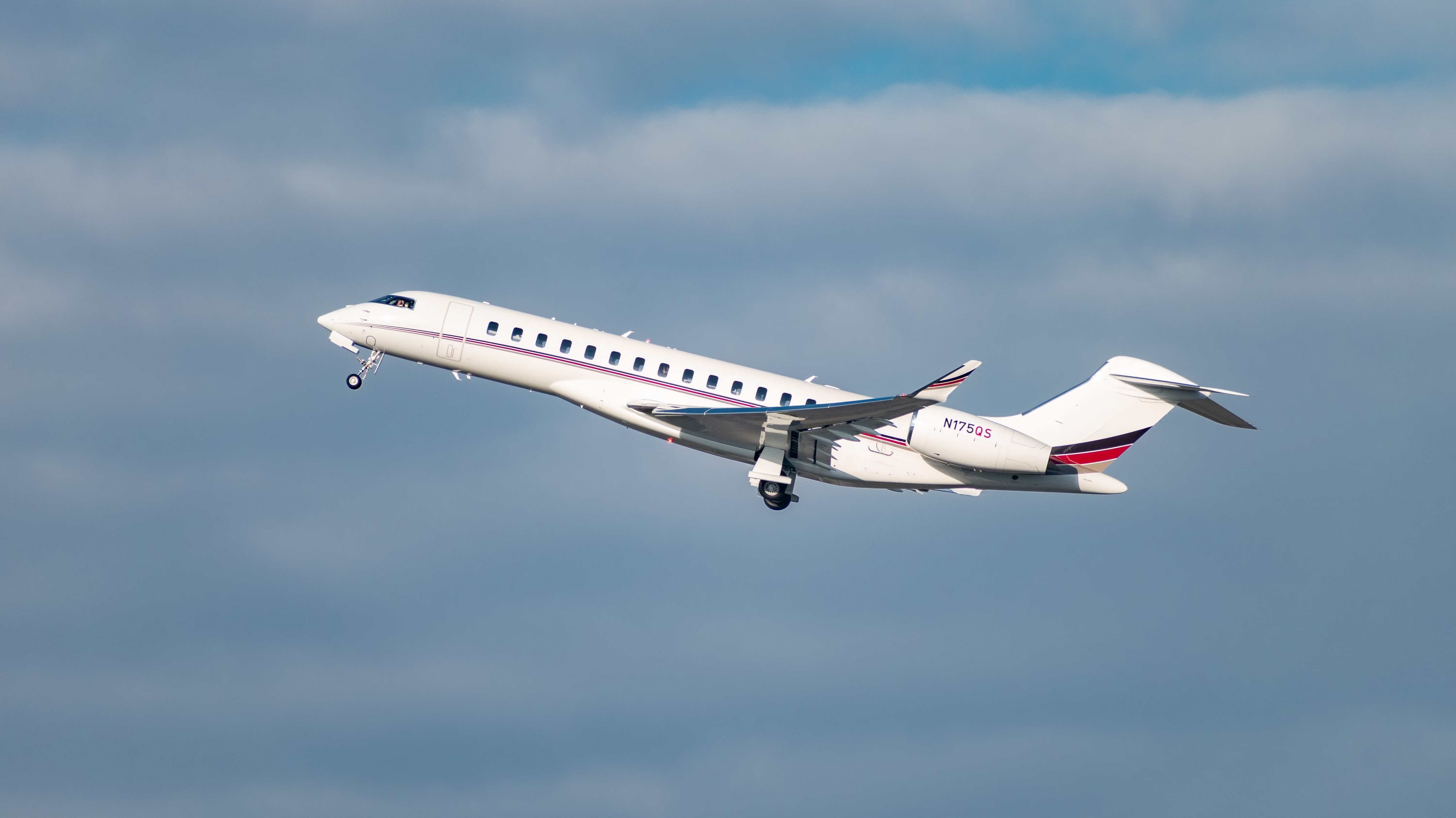 A Bombardier 7500 flying in the sky.