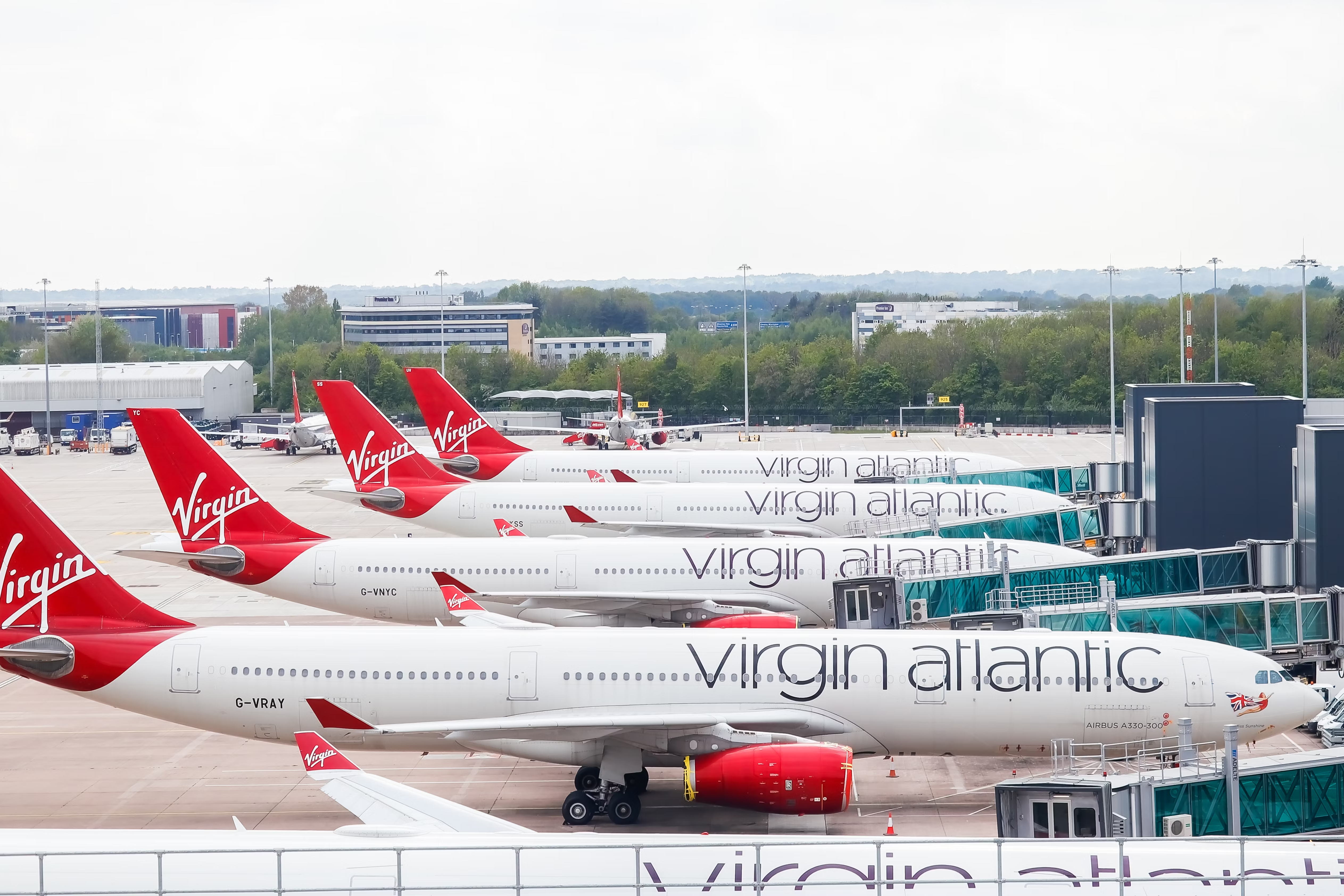 Many Virgin Atlantic Airbus A330s parked side by side.