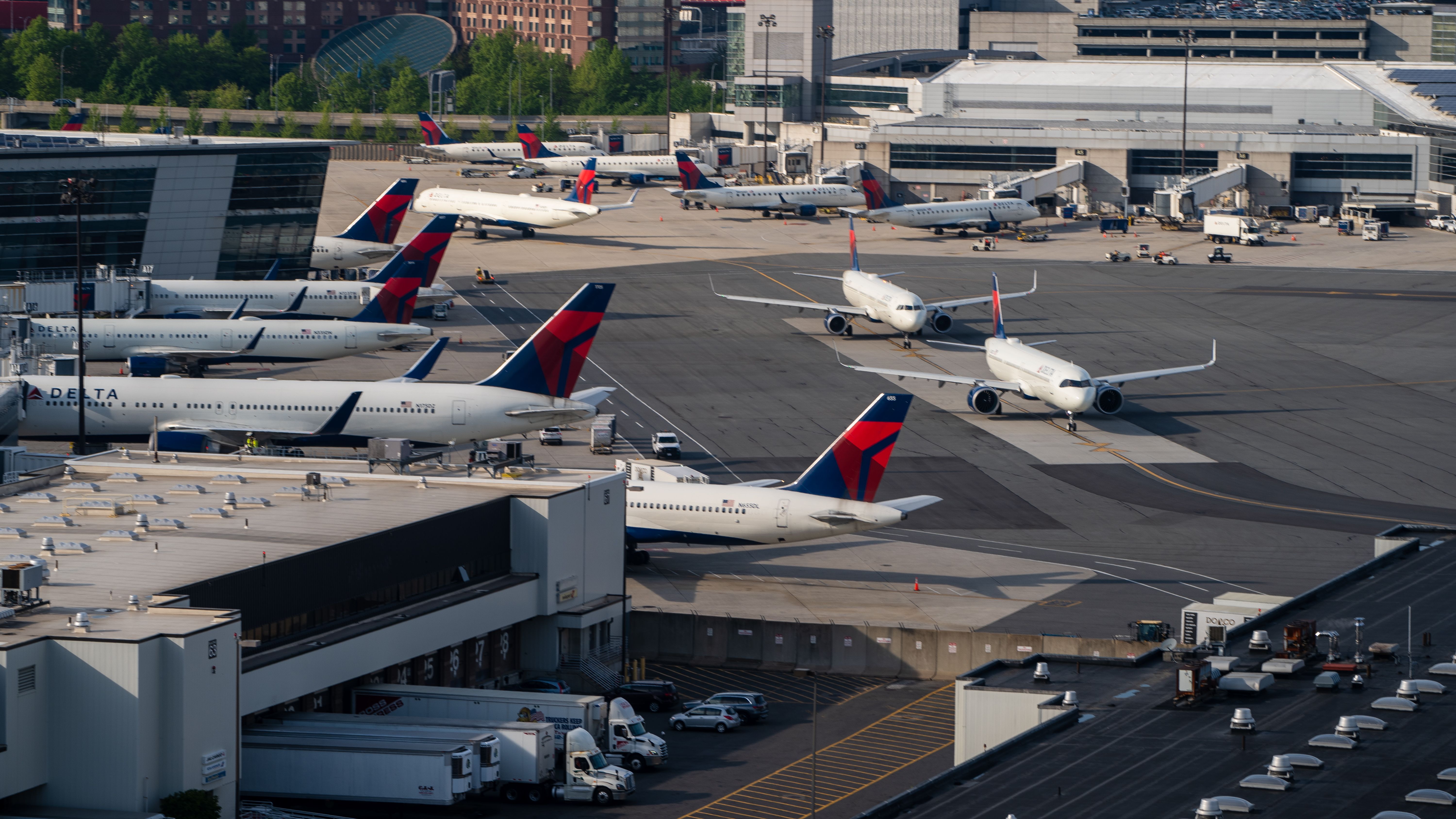 Several Delta Air Lines planes move into Boston Logan Airport.