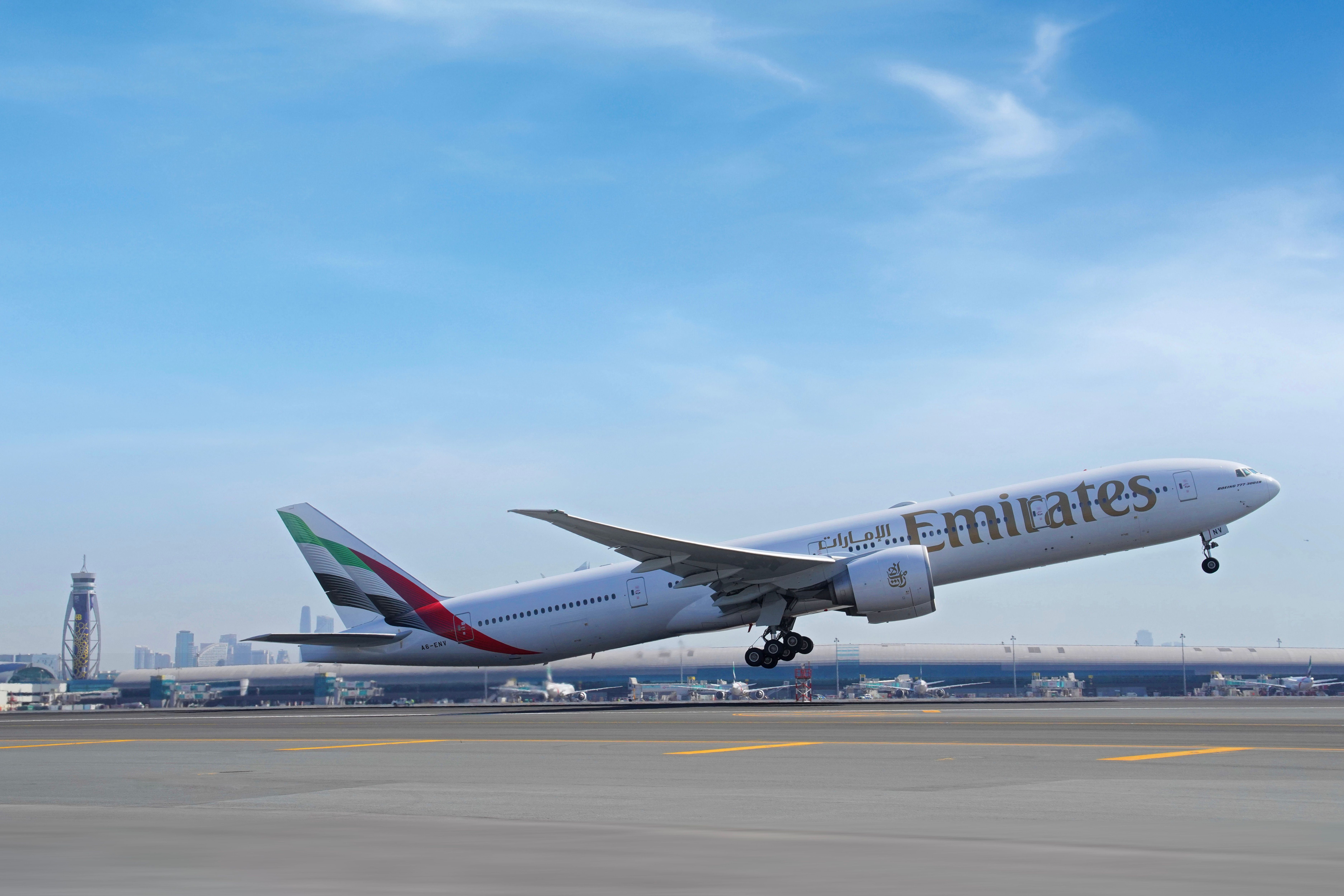 An Emirates Boeing 777 taking off at Dubai Airport.