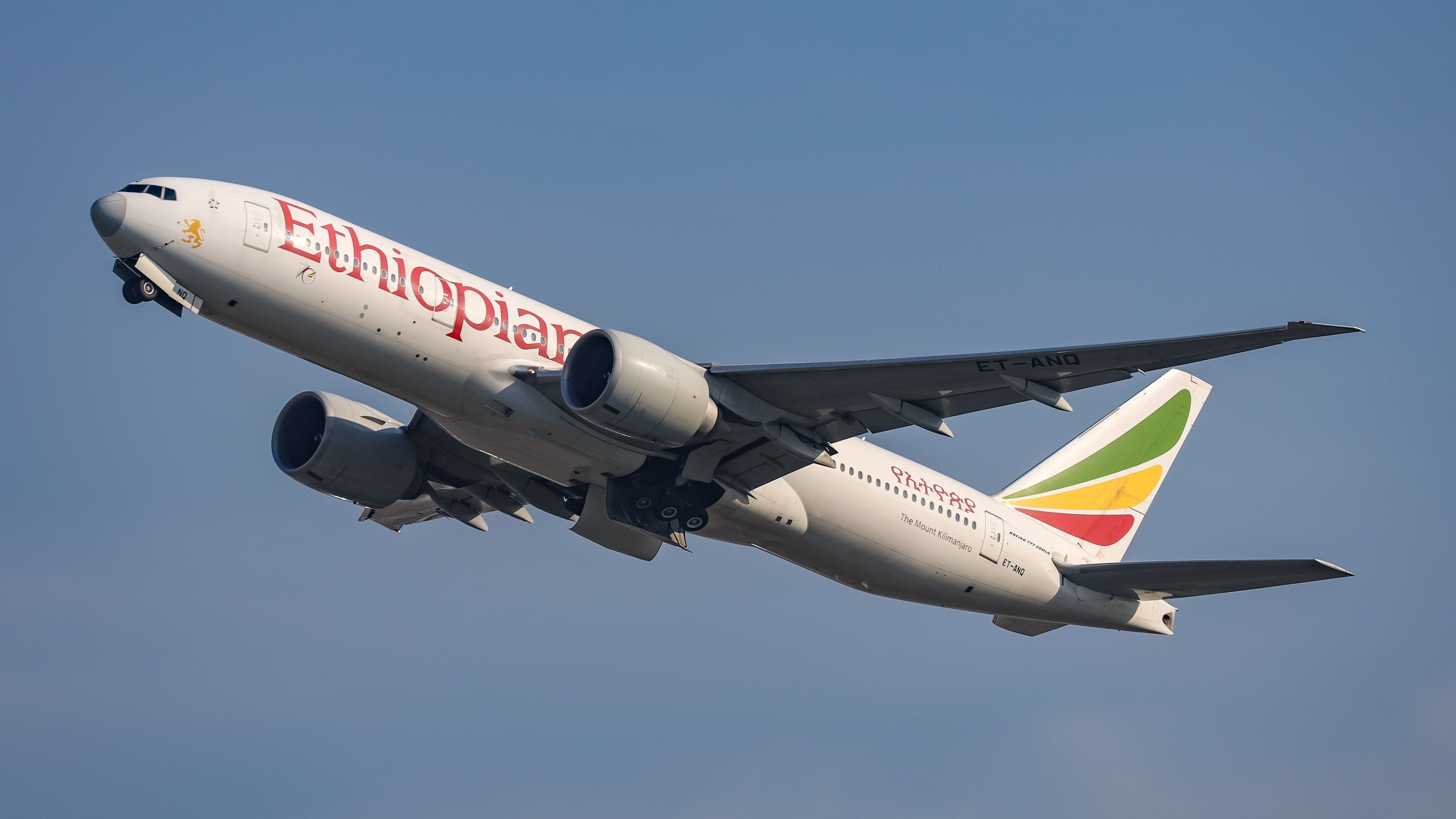 An Ethiopian Airlines Boeing 777-200LR flying in the sky.