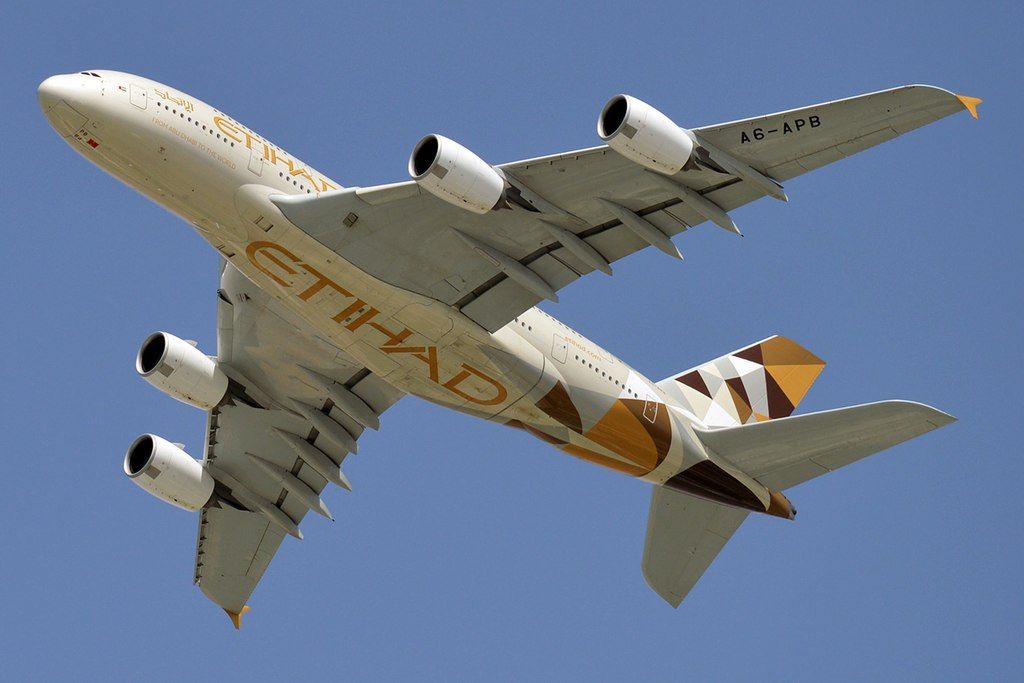 An Etihad Airways Airbus A380 flying overhead.