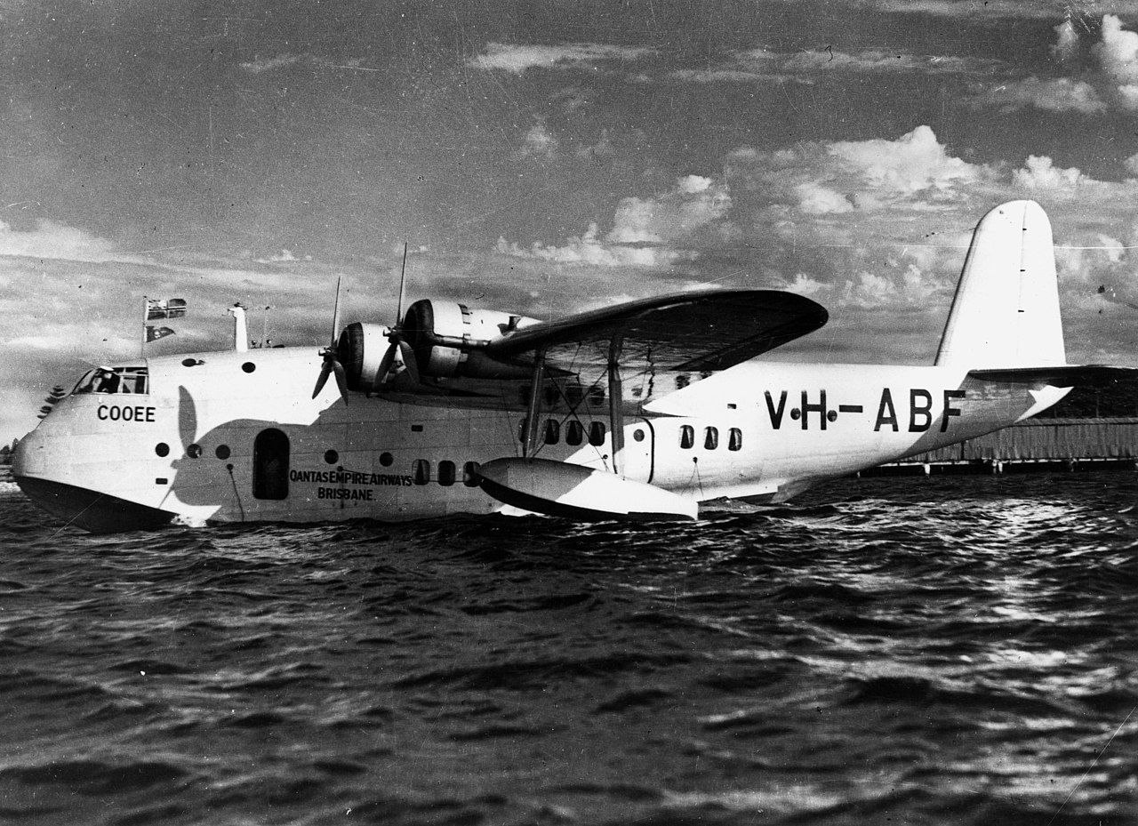 A Qantas Flying boat floating on the water.