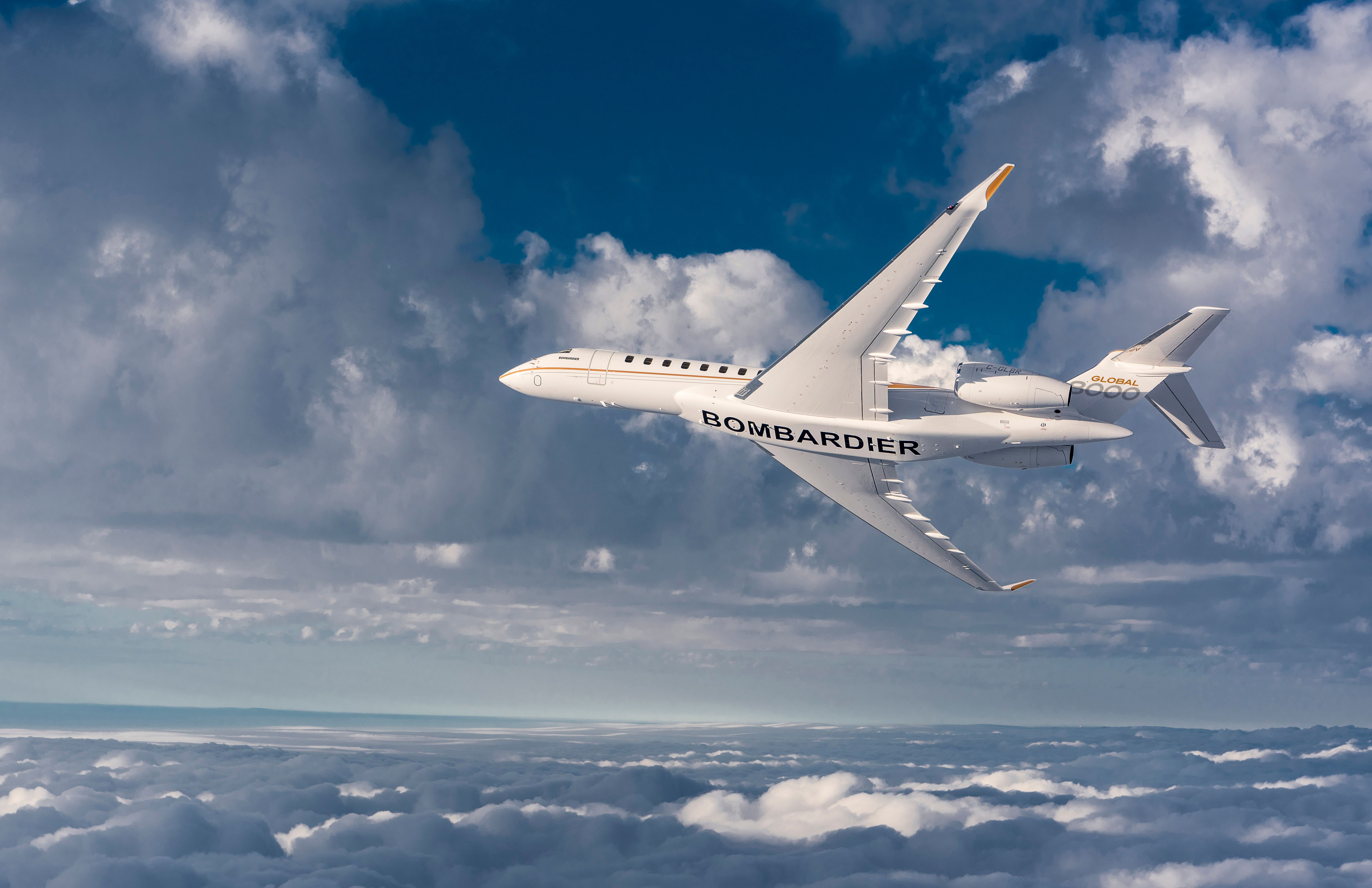 A Bombardier Global 8000 Banking to the right.