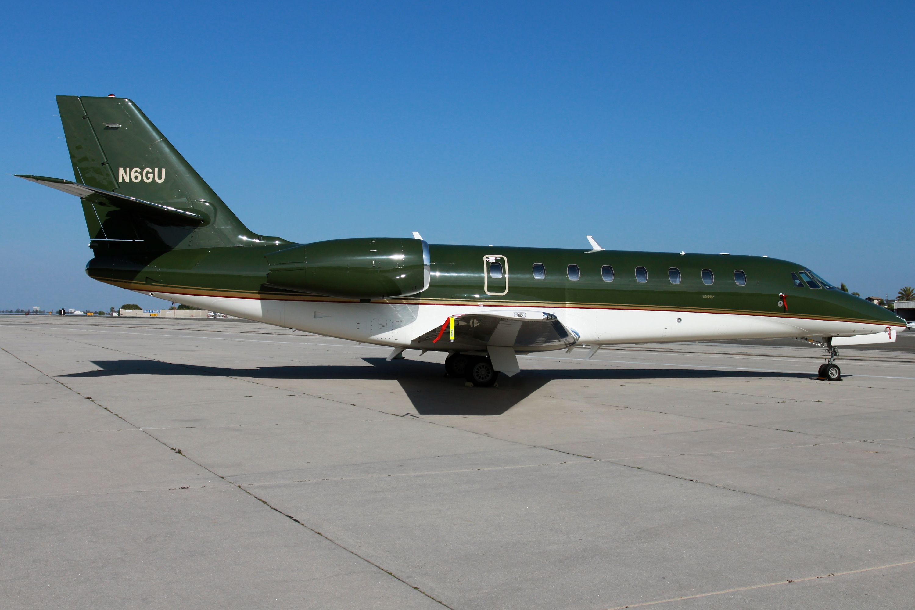 Harrison Ford's private jet parked at an airport.