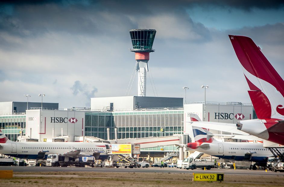 London Heathrow Airport ATC Tower With Mixed Tails In Foreground