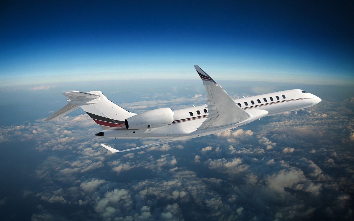 A render of a NetJets Bombardier Global 8000 flying in the sky.