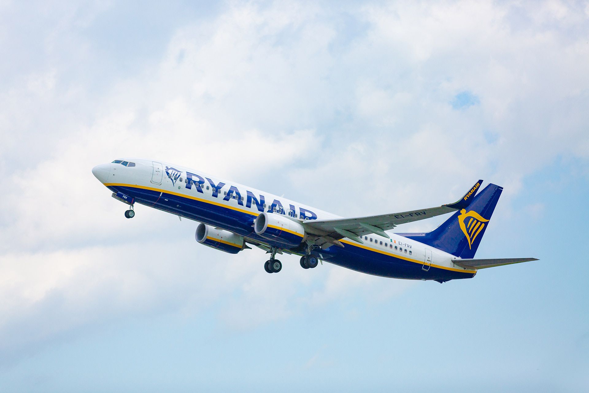 A Ryanair Boeing 737 flying in the sky.