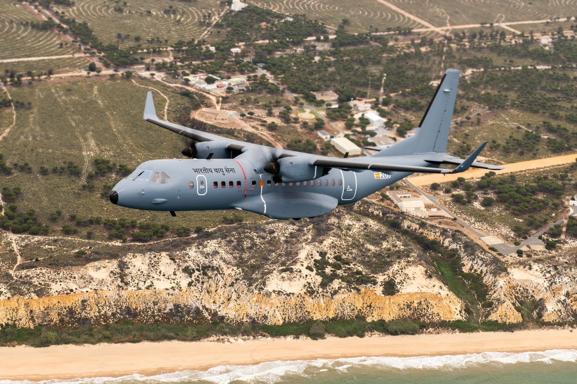 An Airbus C-295 of the Indian Air Force flying above terrain.