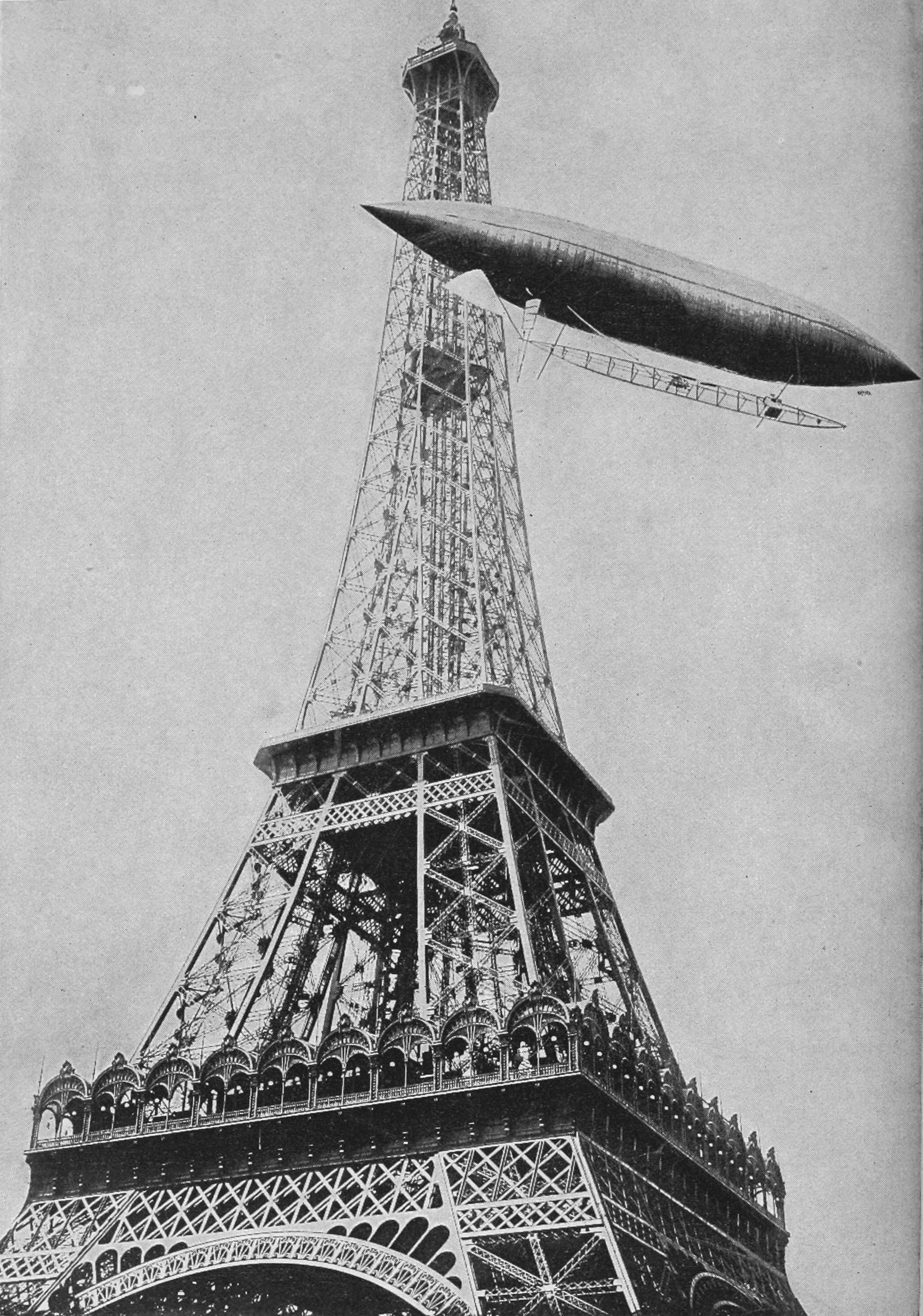 Santos-Dumont flies around the Eiffel Tower.