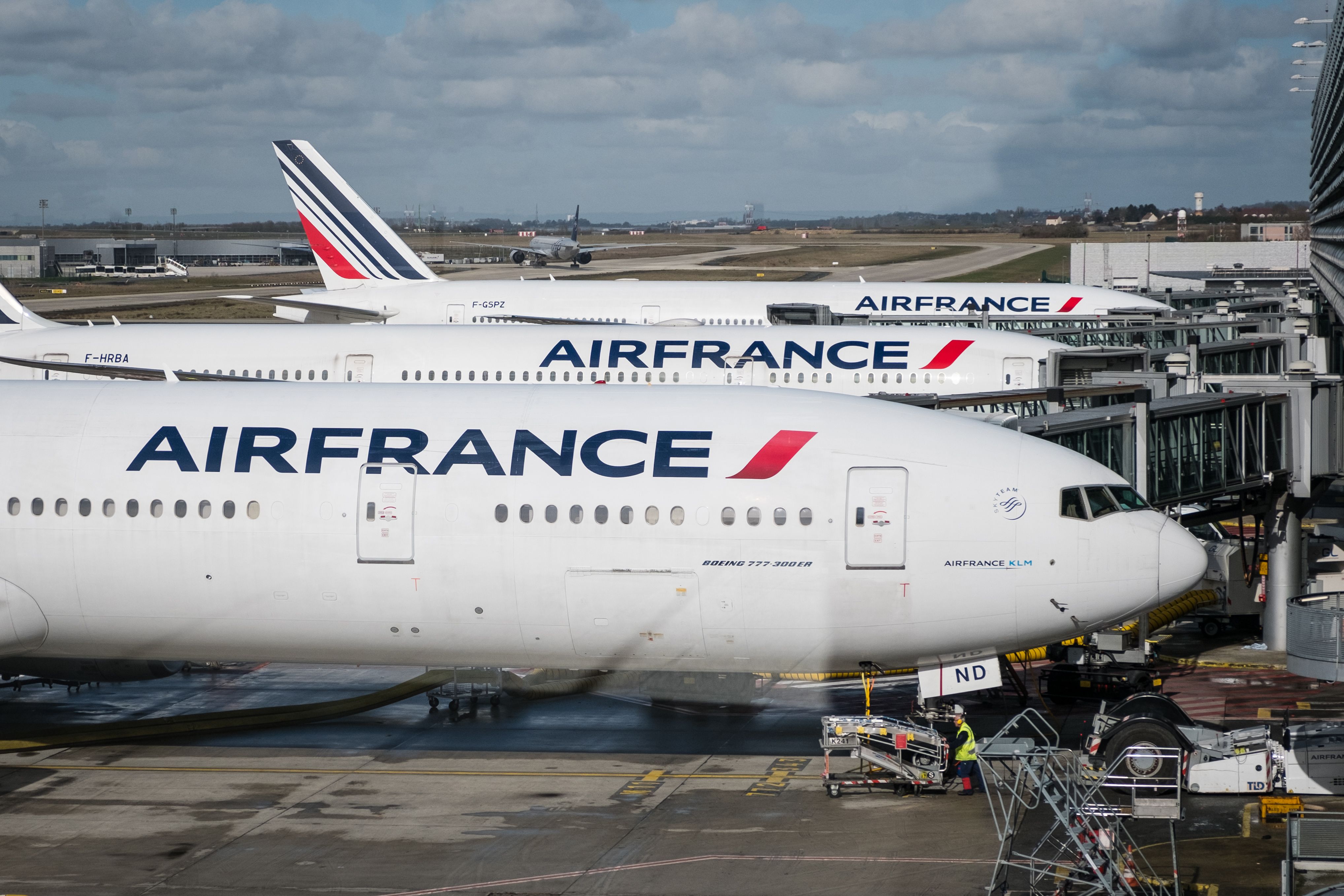 Several Air France aircraft parked at Paris CDG airport.