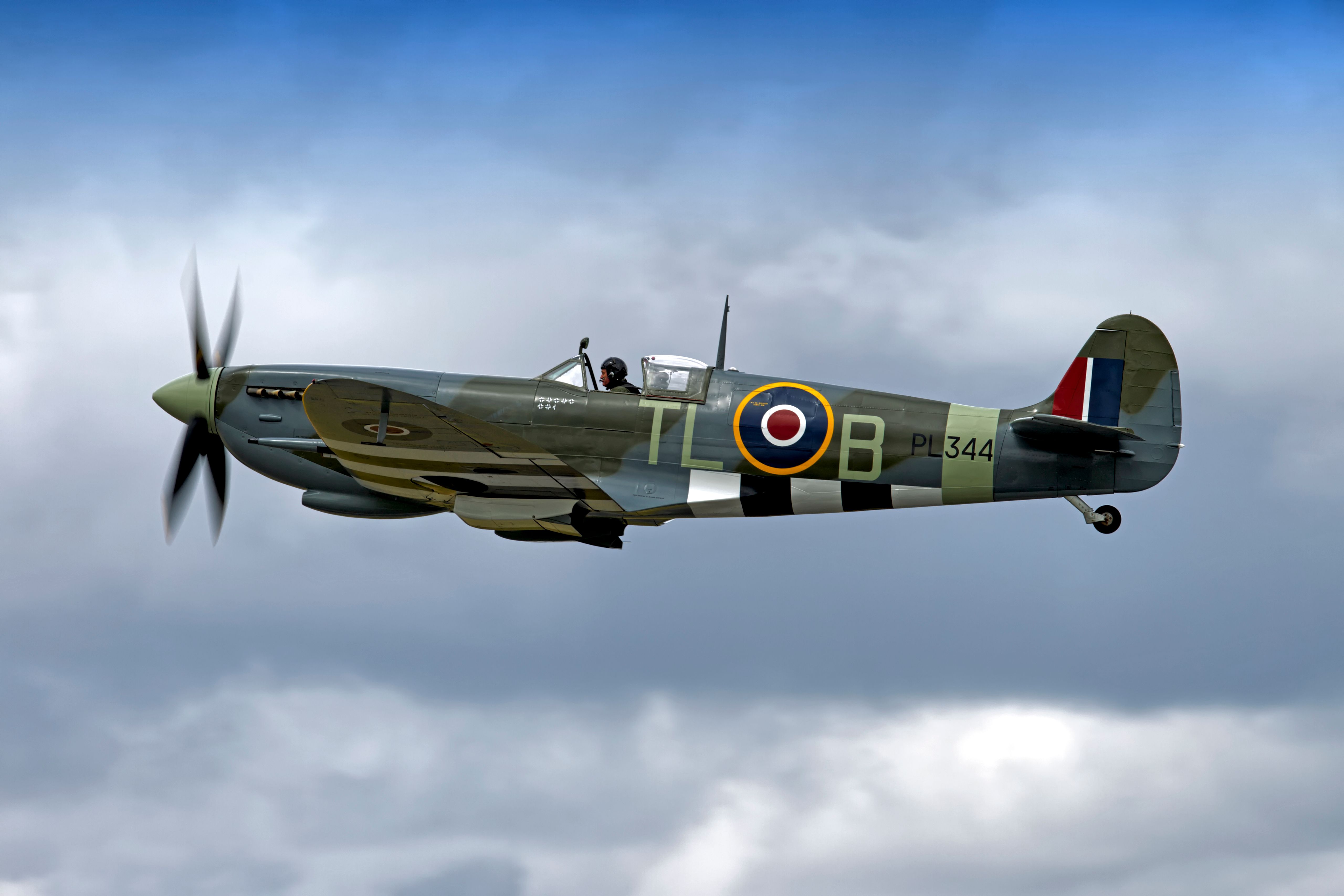 A Supermarine Spitfire flying in the sky.