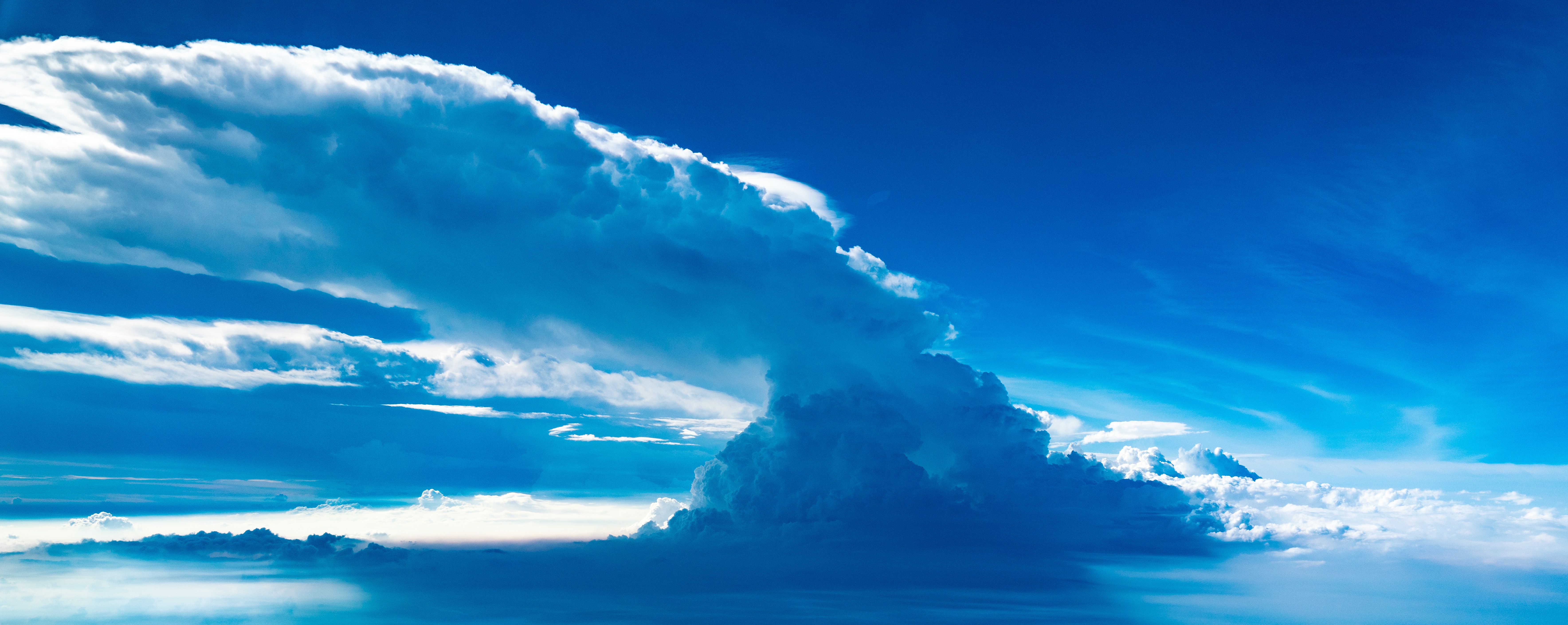 A large cumulonimbus thunderstorm cloud viewed from the air.