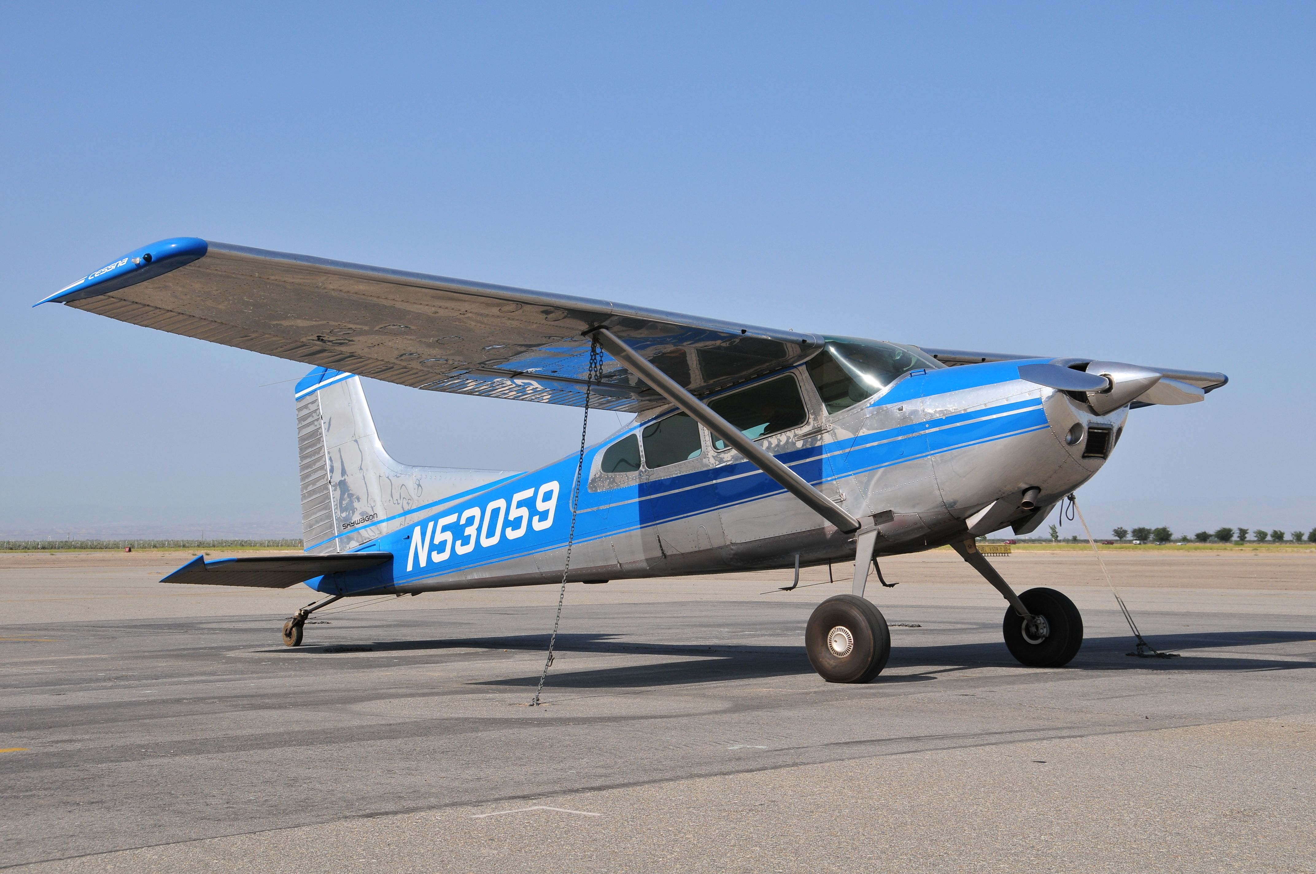 A Cessna 180 Skywagon parked at an airport.