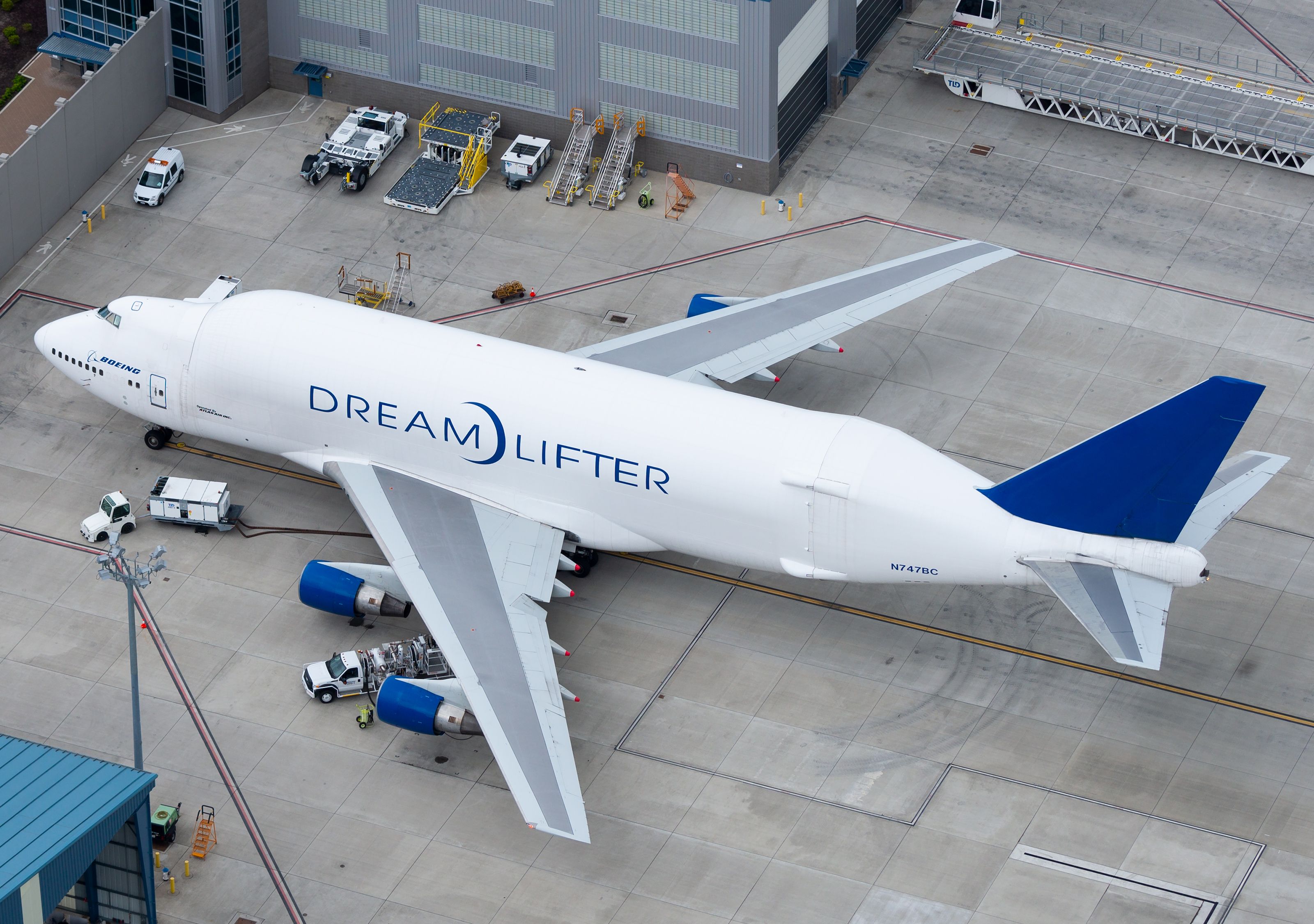 A Boeing Dreamlifter parked at an airport.