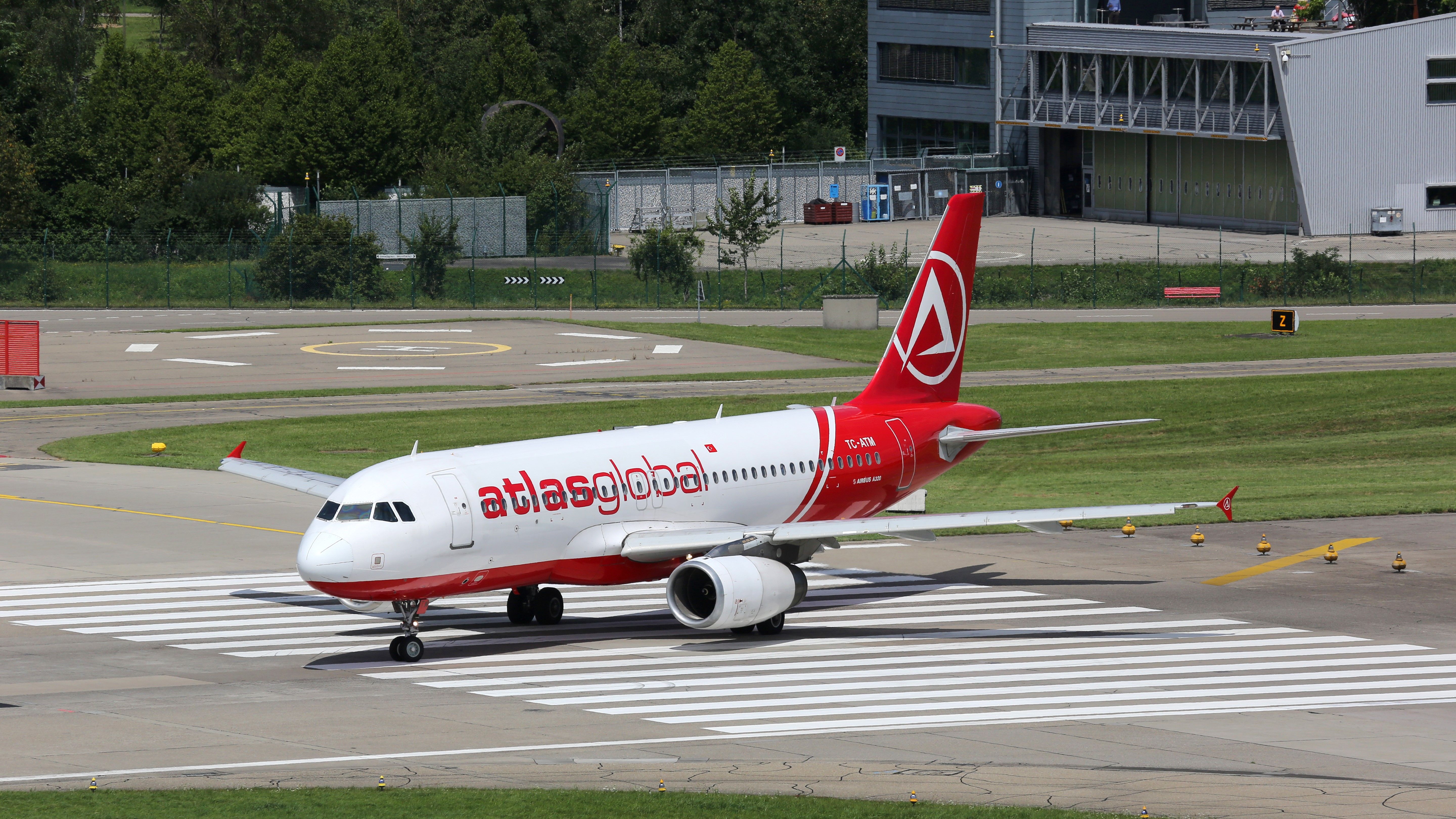 An AtlasGlobal Airbus A320 Taxiing In Zurich.