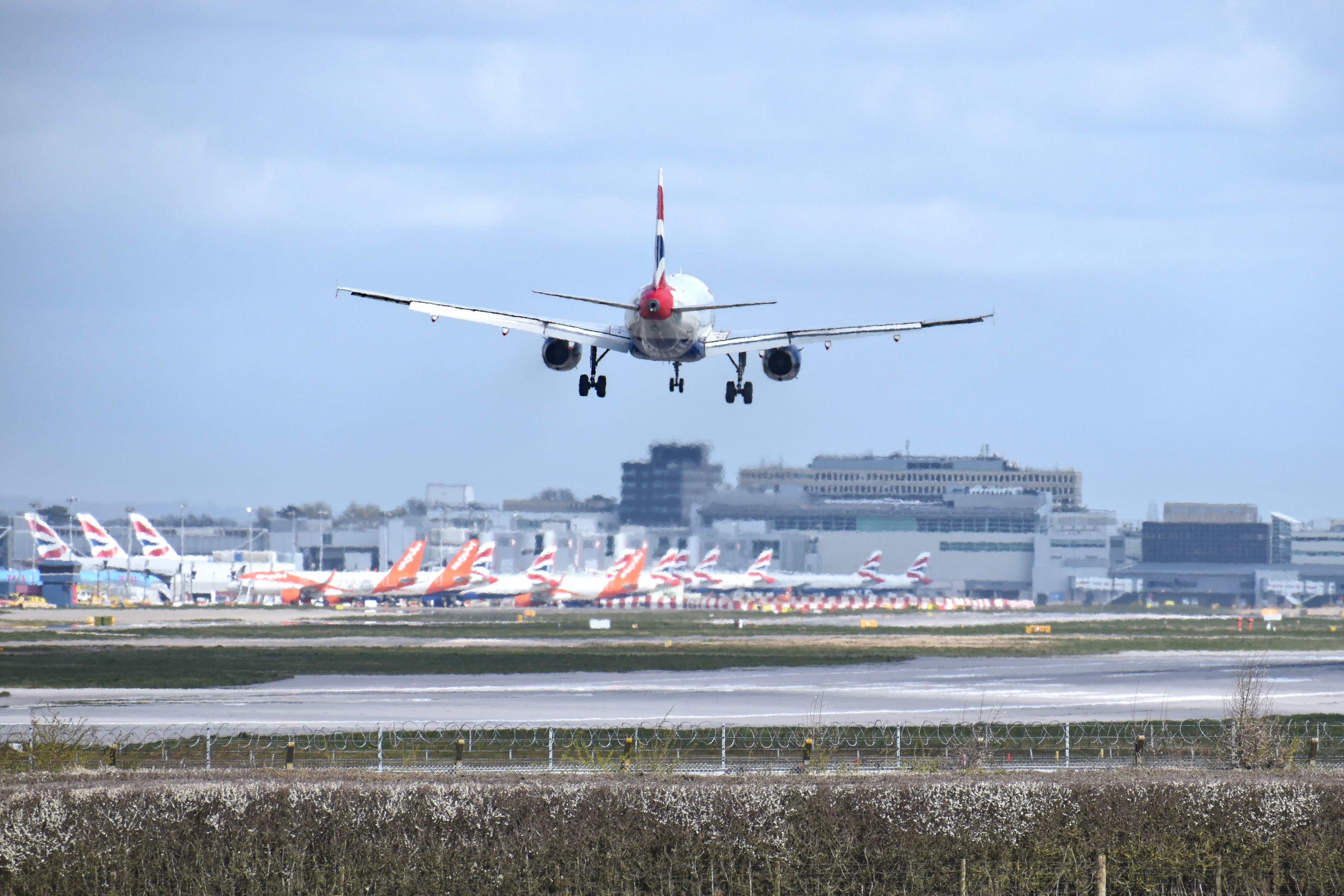 A British Airways Airbus A319-131 comes into land at Gatwick Airport.