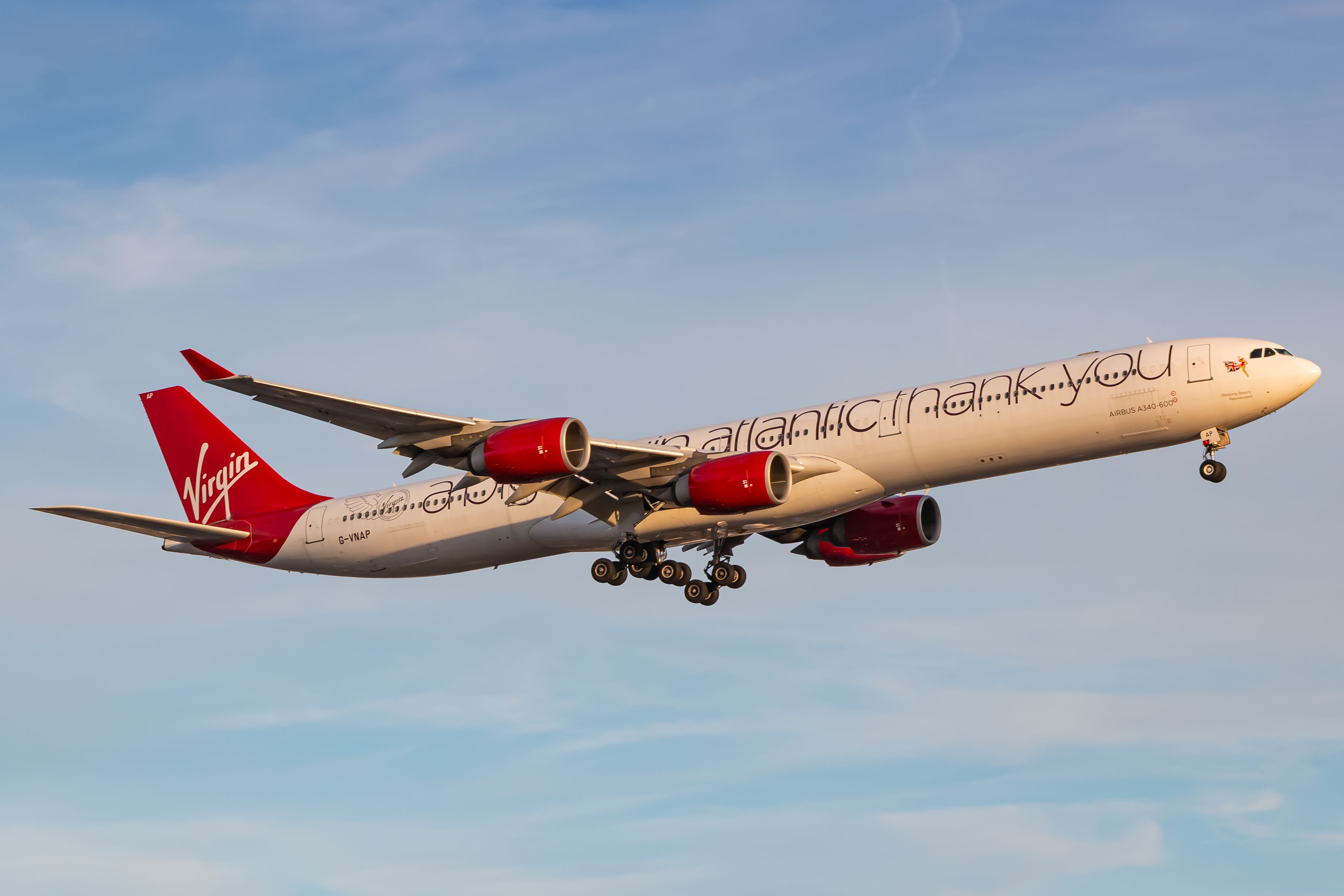 A Virgin Atlantic Airbus A340 flying in the sky.