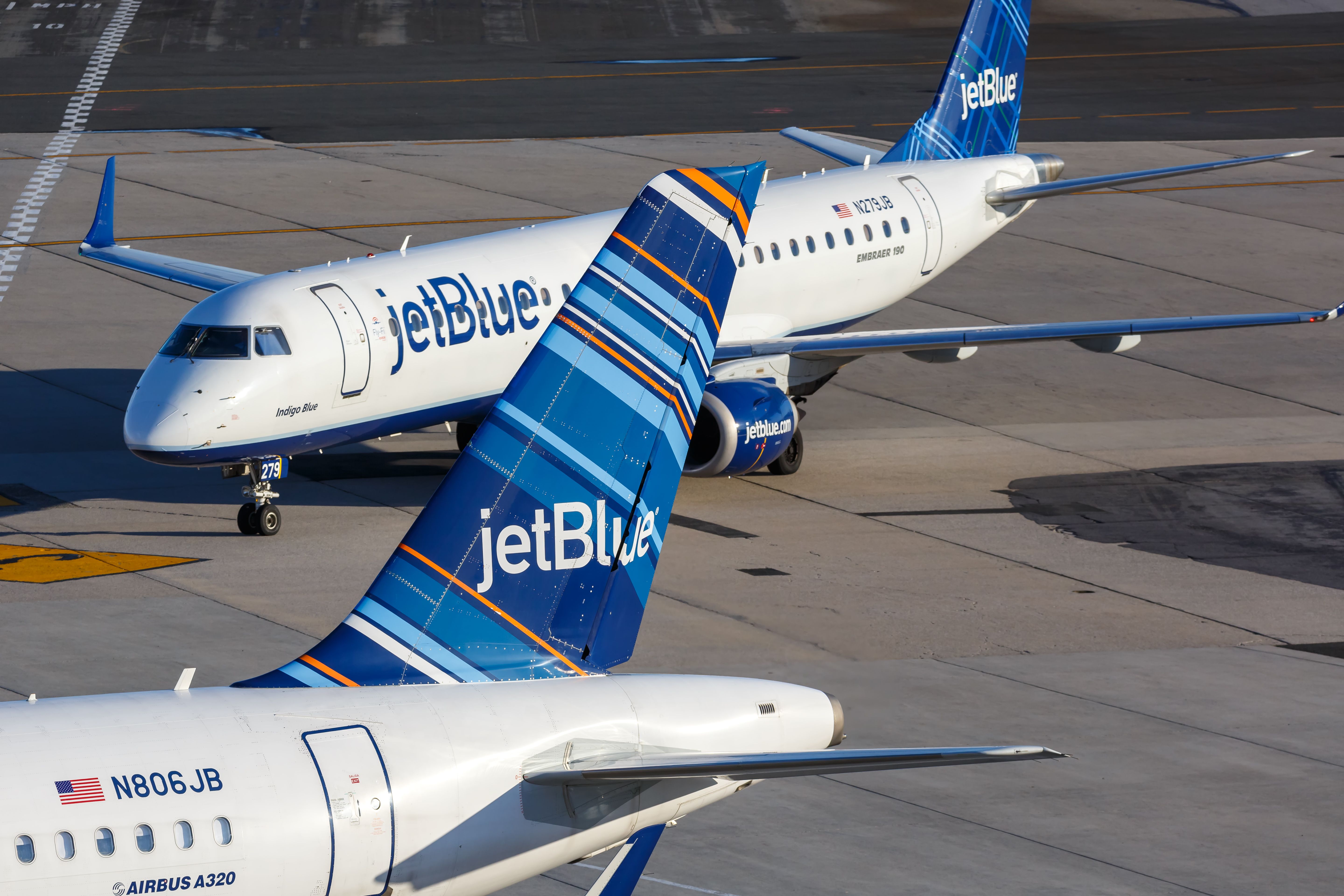 A JetBlue Embraer 190 on the apron at New York JFK airport.
