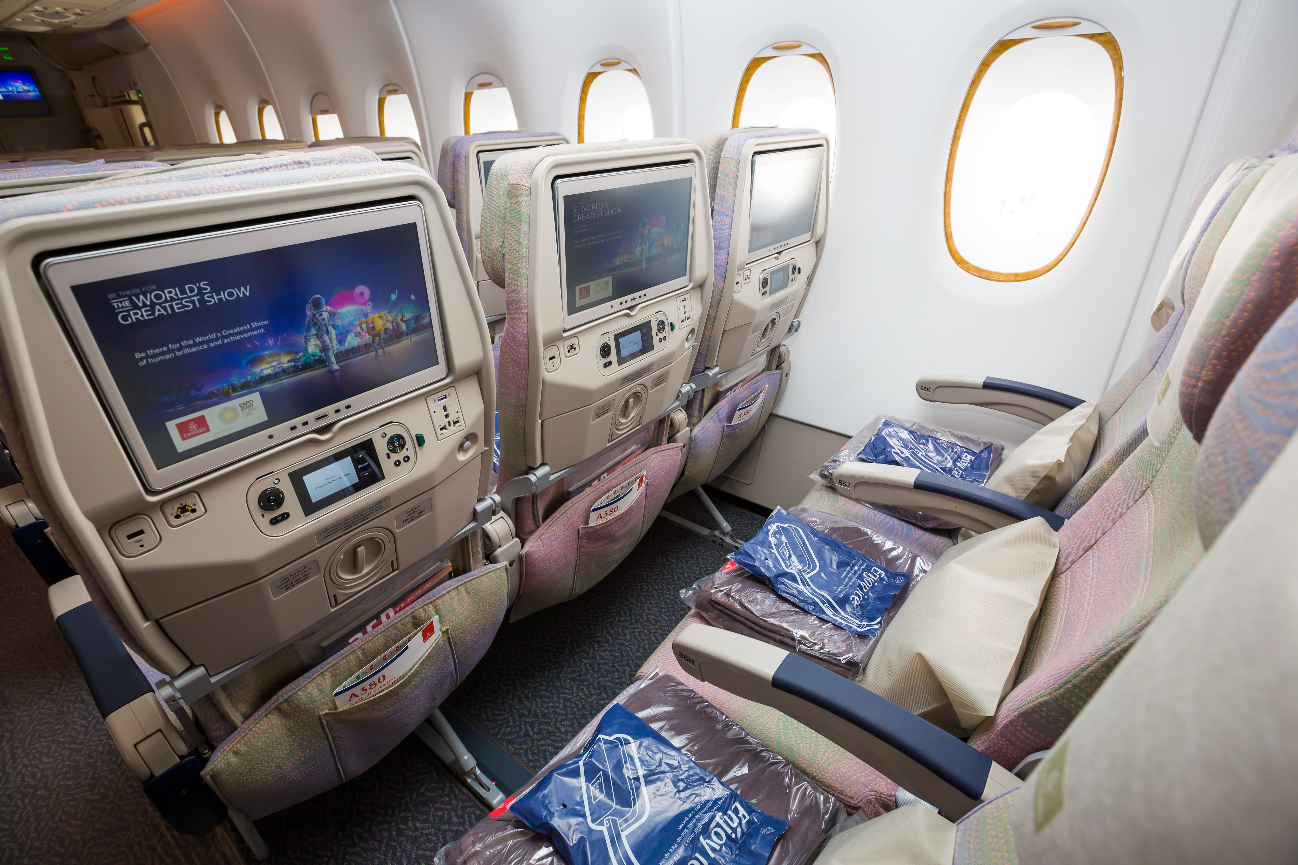 A standard row in an Emirates Economy Class cabin before boarding.