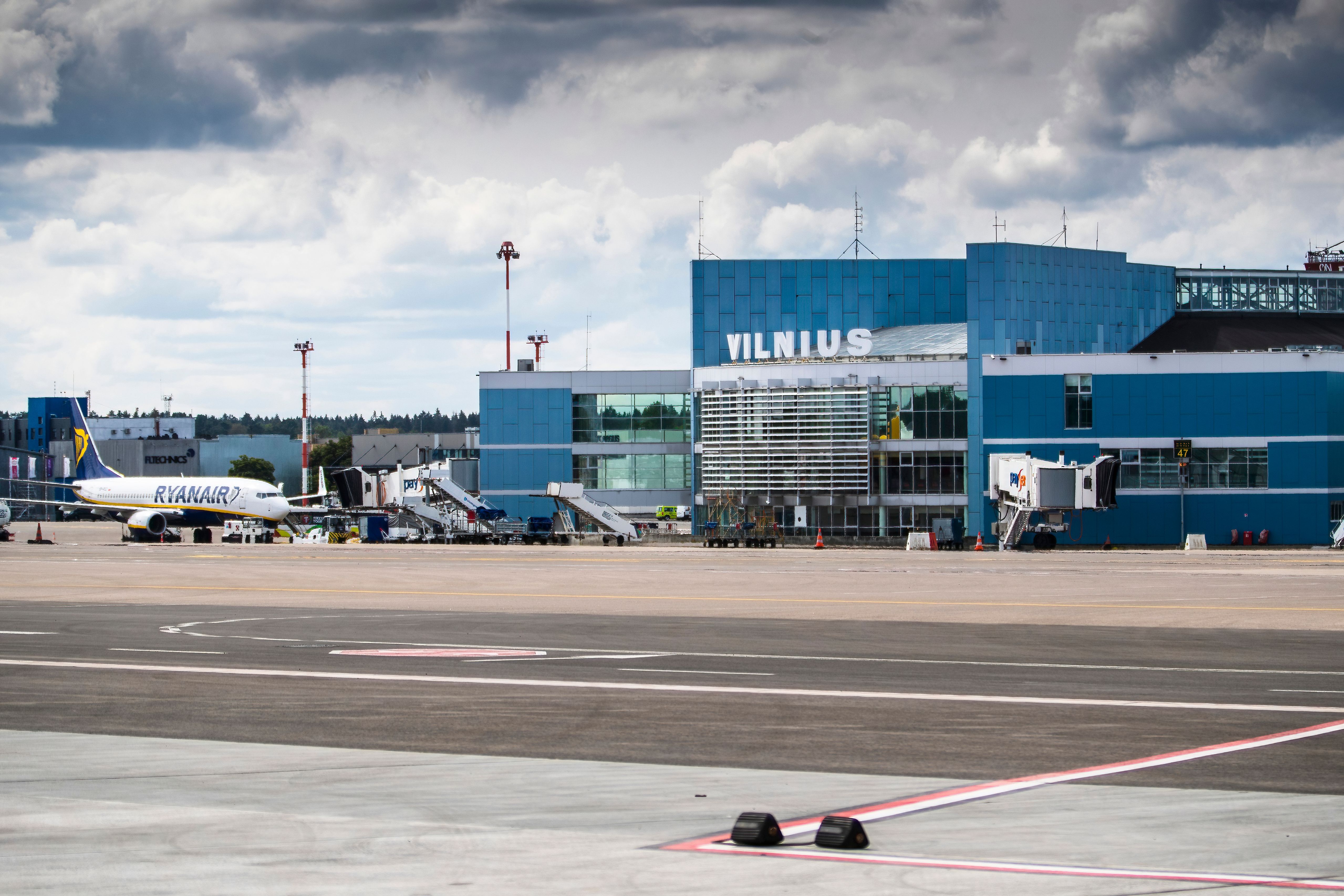 A Ryanair aircraft taxiing near the Vilnius Airport terminal building.