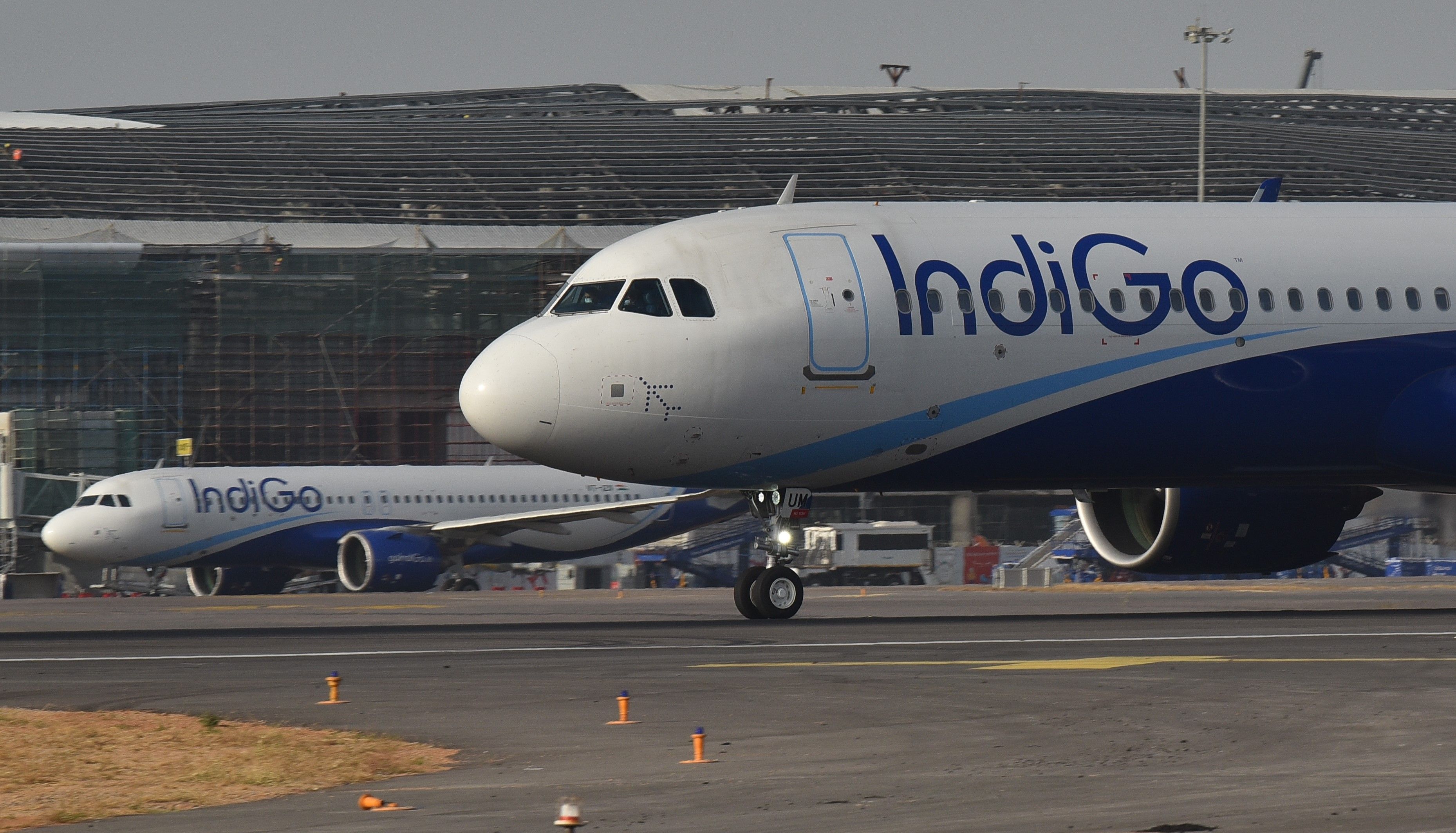 IndiGo Airbus A320 aircraft parked at Hyderabad Airport.