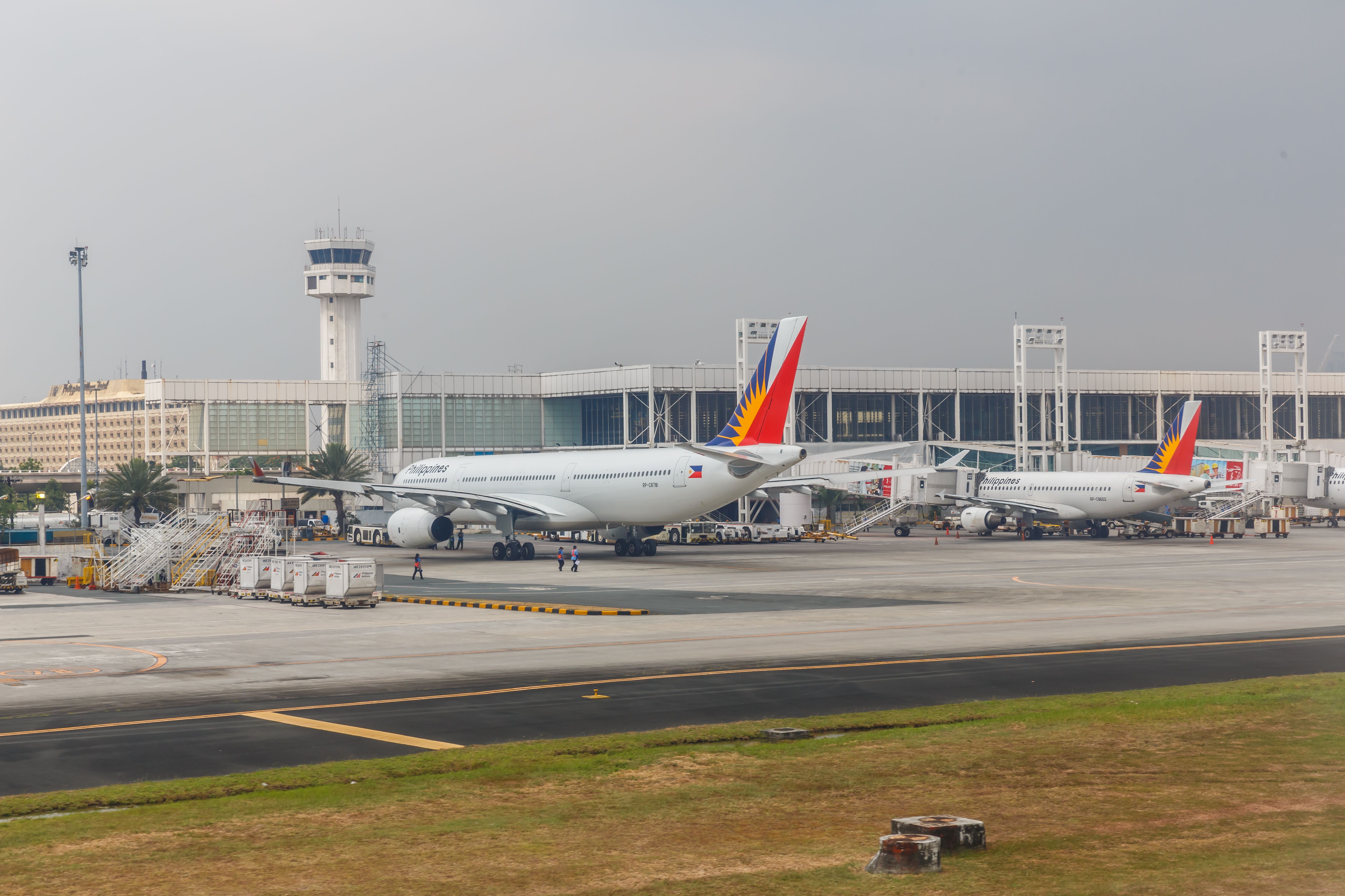 Philippine Airlines planes parked at Manila Airport